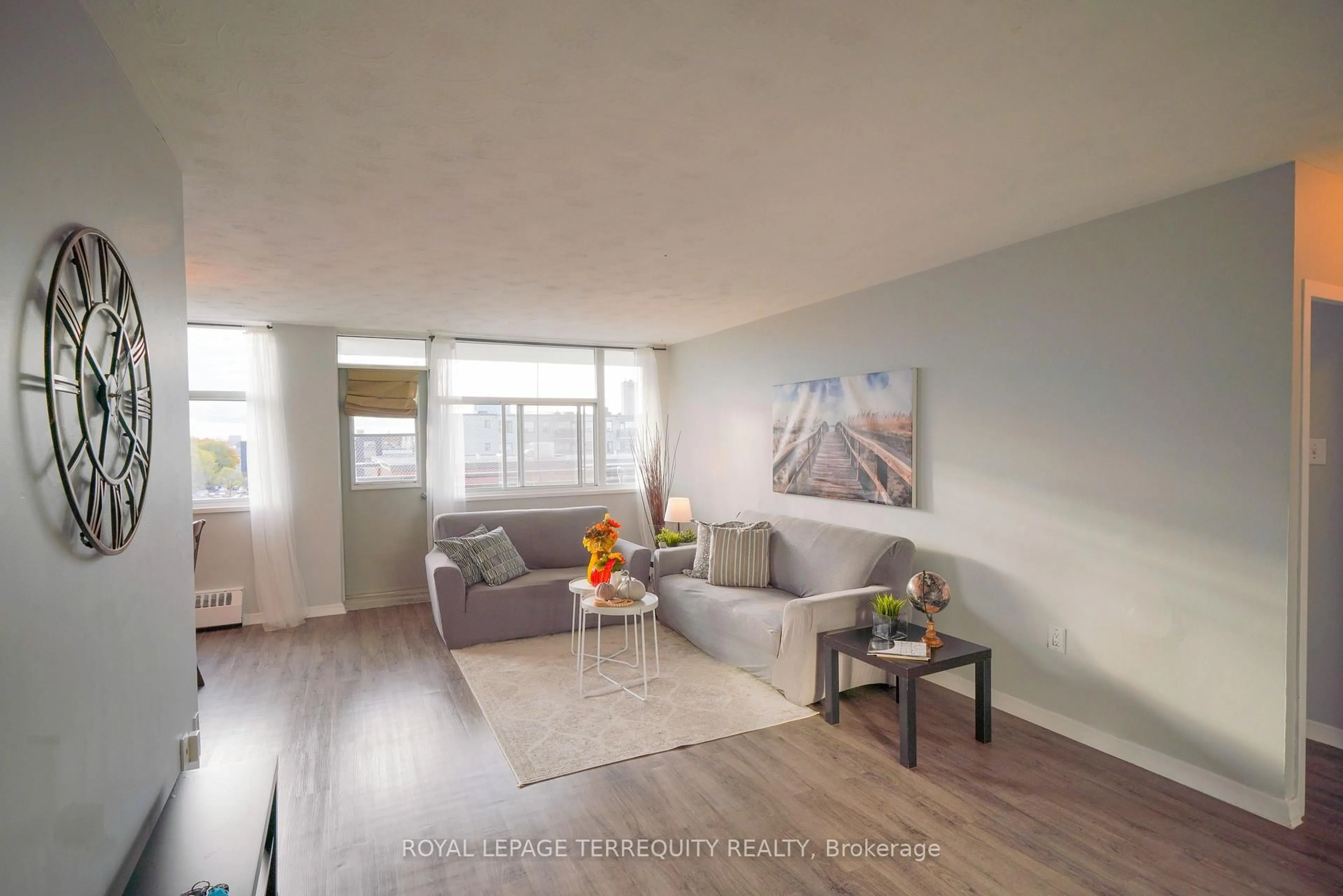 Living room with furniture, wood/laminate floor for 2245 Eglinton Ave #807, Toronto Ontario M1K 2N3