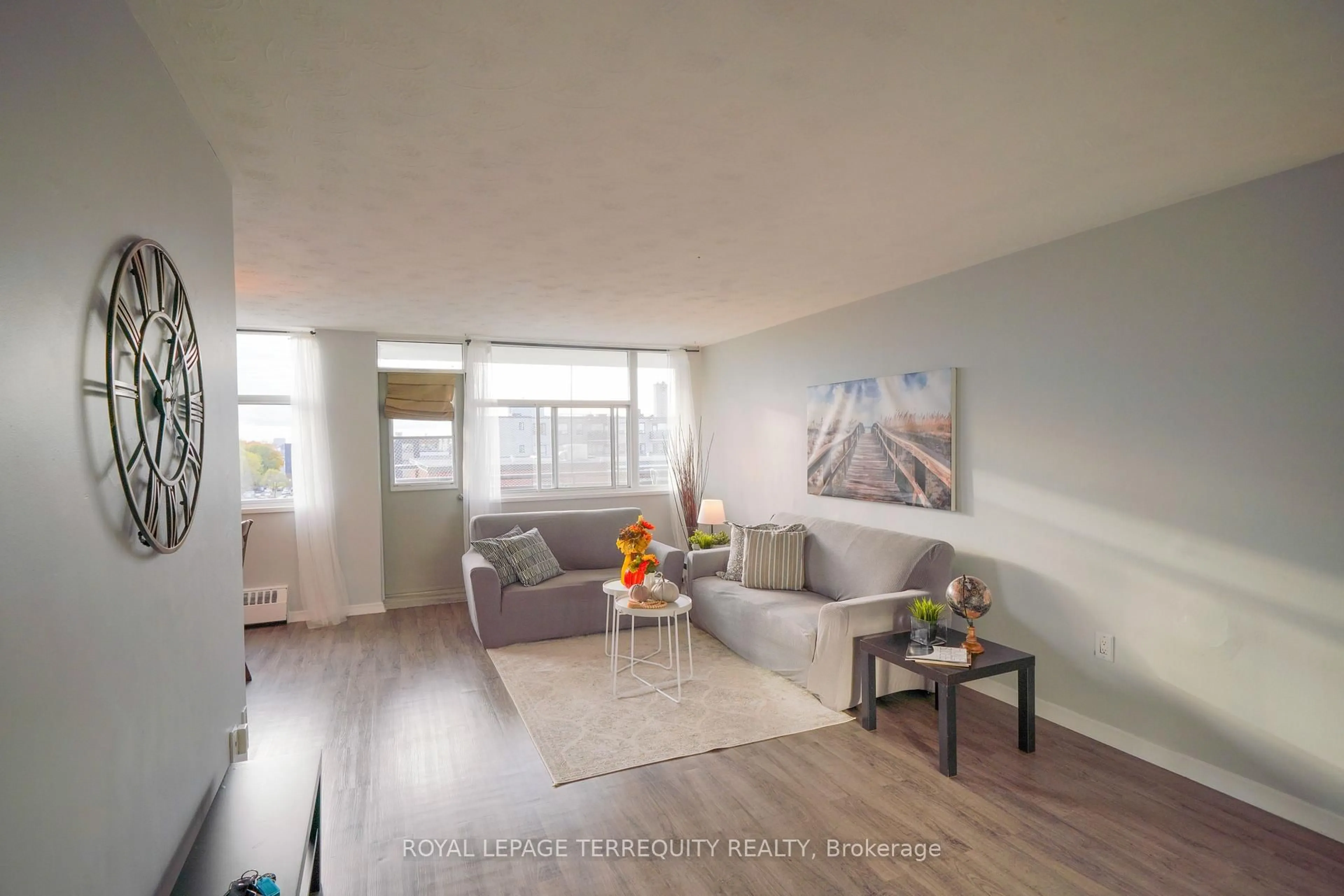 Living room with furniture, wood/laminate floor for 2245 Eglinton Ave #807, Toronto Ontario M1K 2N3