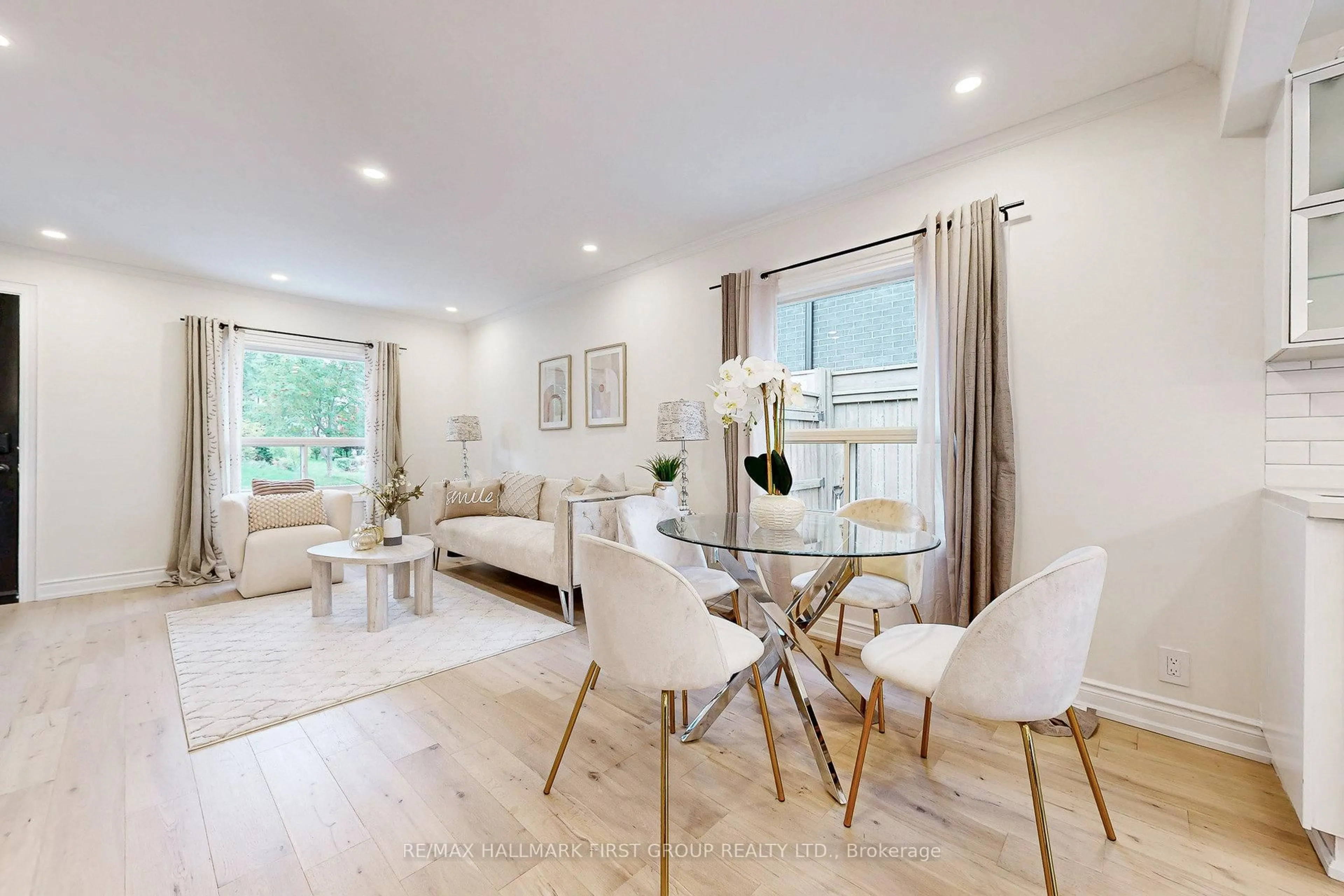 Living room with furniture, wood/laminate floor for 589 Marksbury Rd, Pickering Ontario L1W 2T1