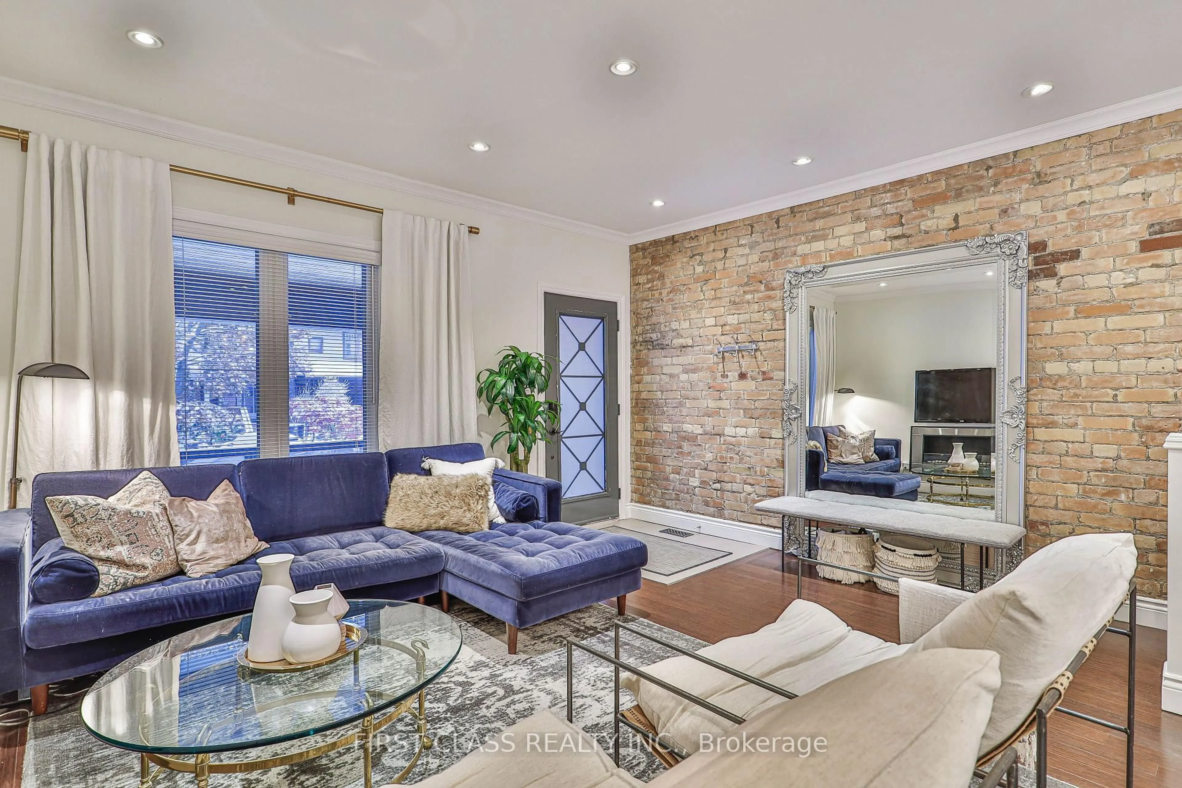 Living room with furniture, ceramic/tile floor for 14 Herbert Ave, Toronto Ontario M4L 3P9