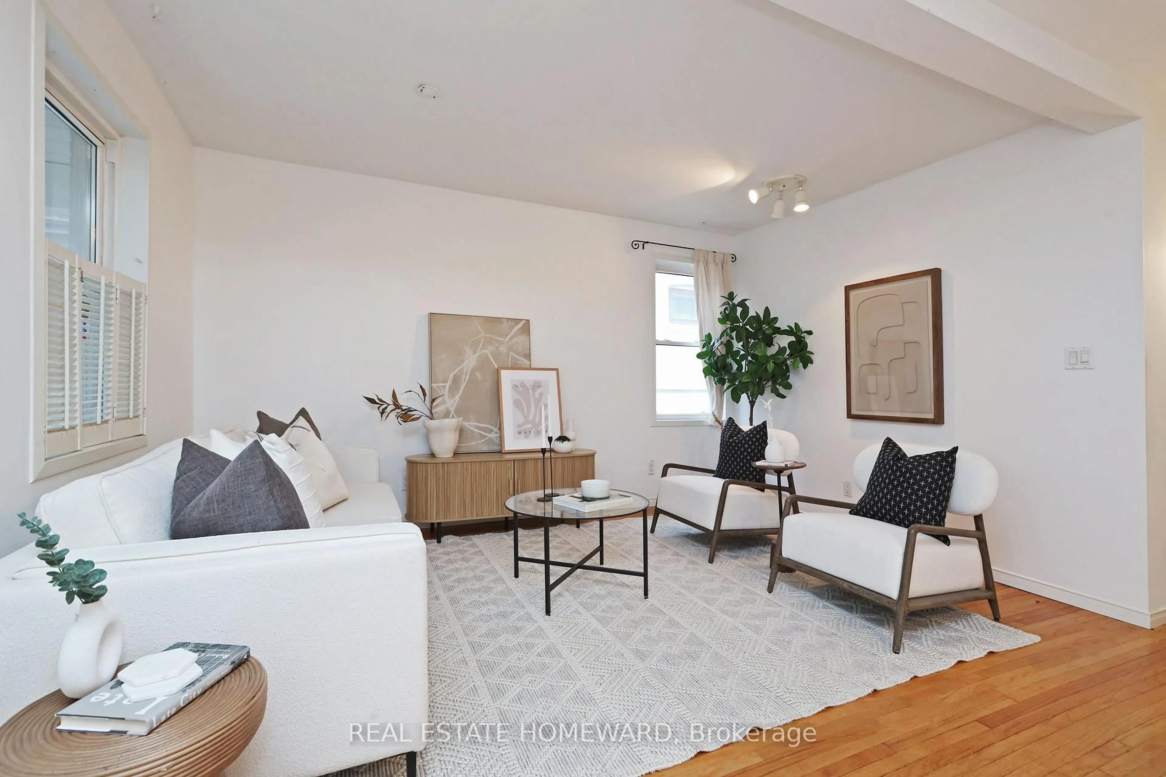Living room with furniture, wood/laminate floor for 281 queensdale Ave, Toronto Ontario M4C 2B5