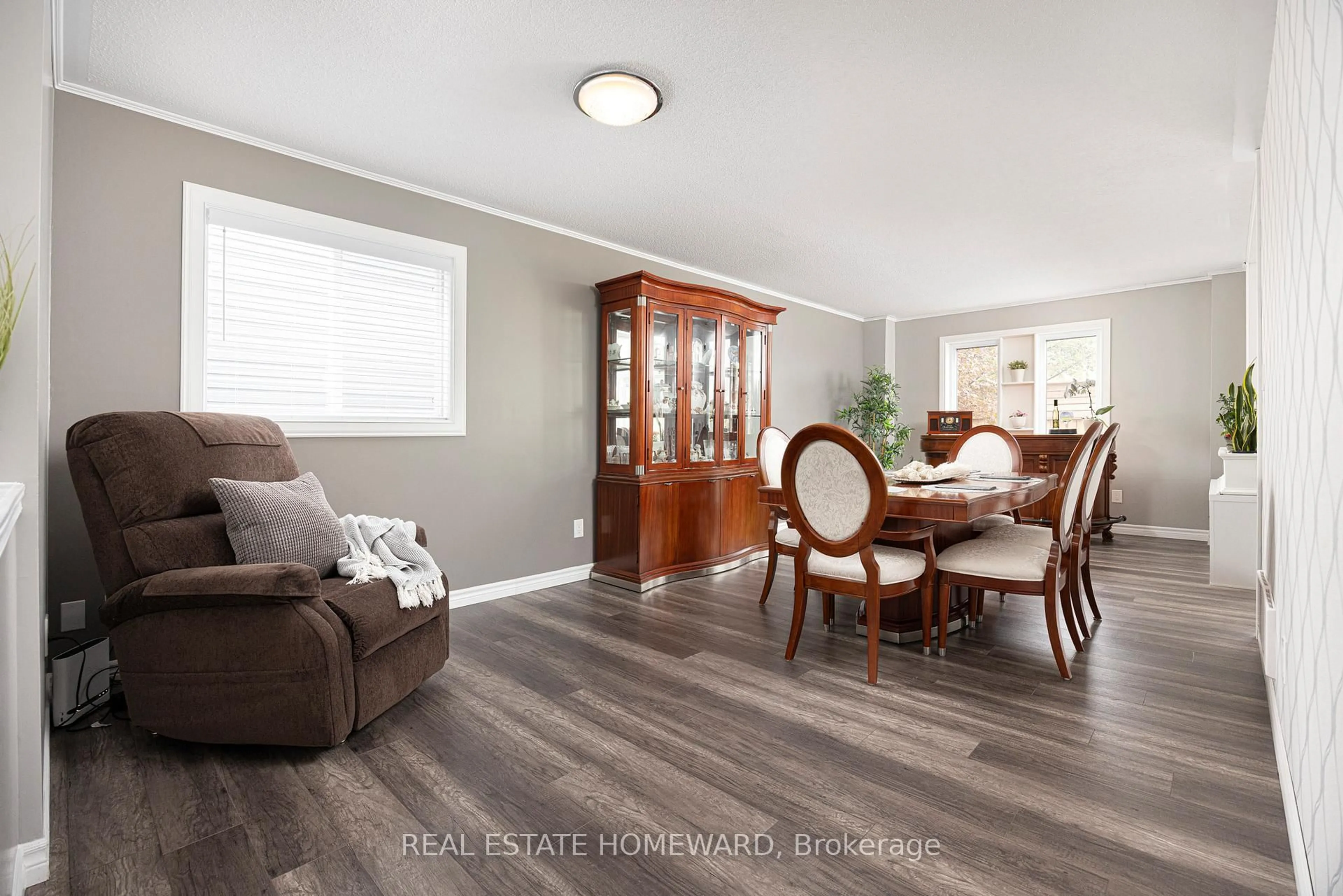 Living room with furniture, wood/laminate floor for 49 Waterview Lane, Clarington Ontario L1B 1P5