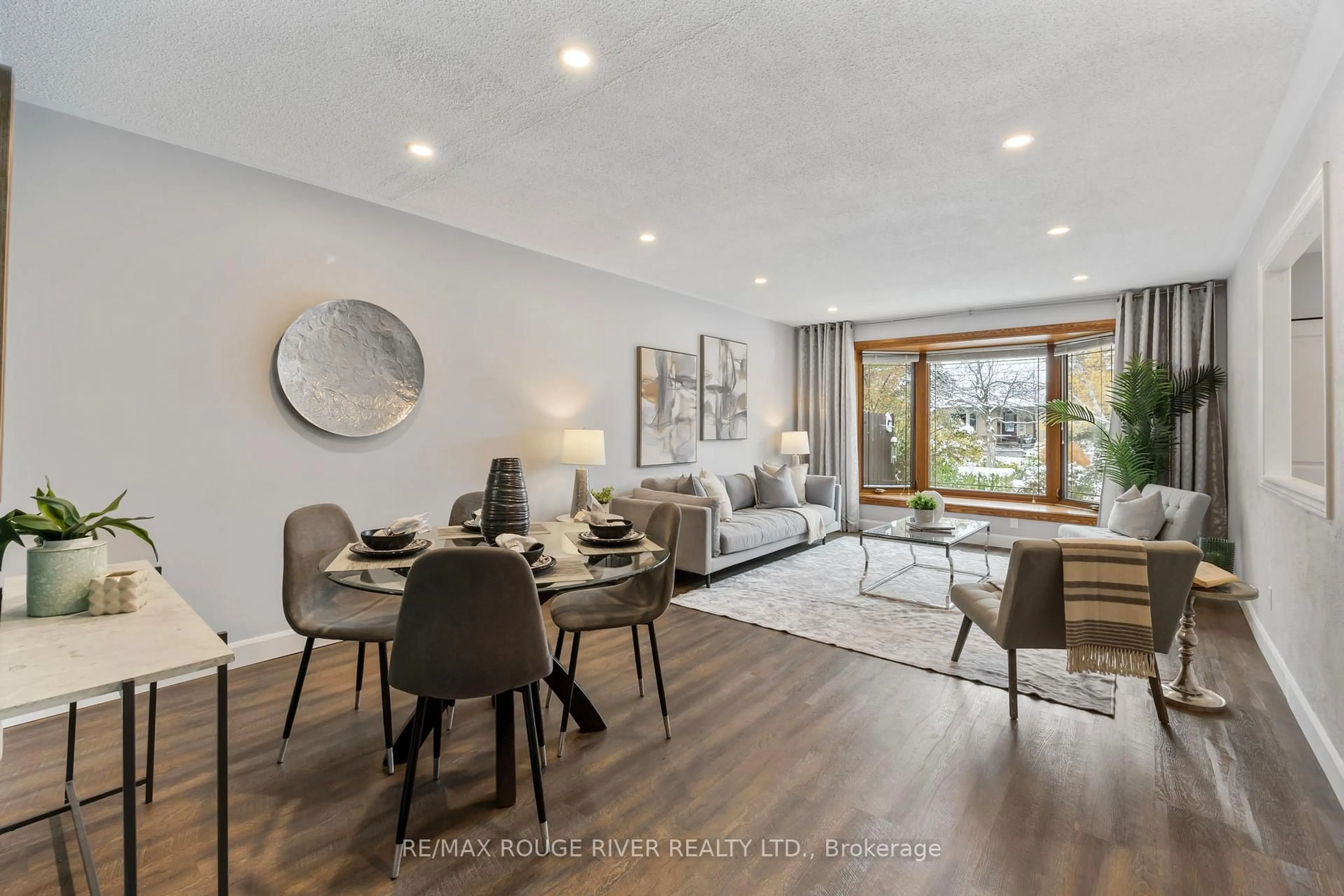 Living room with furniture, wood/laminate floor for 819 Sanok Dr, Pickering Ontario L1W 2R1