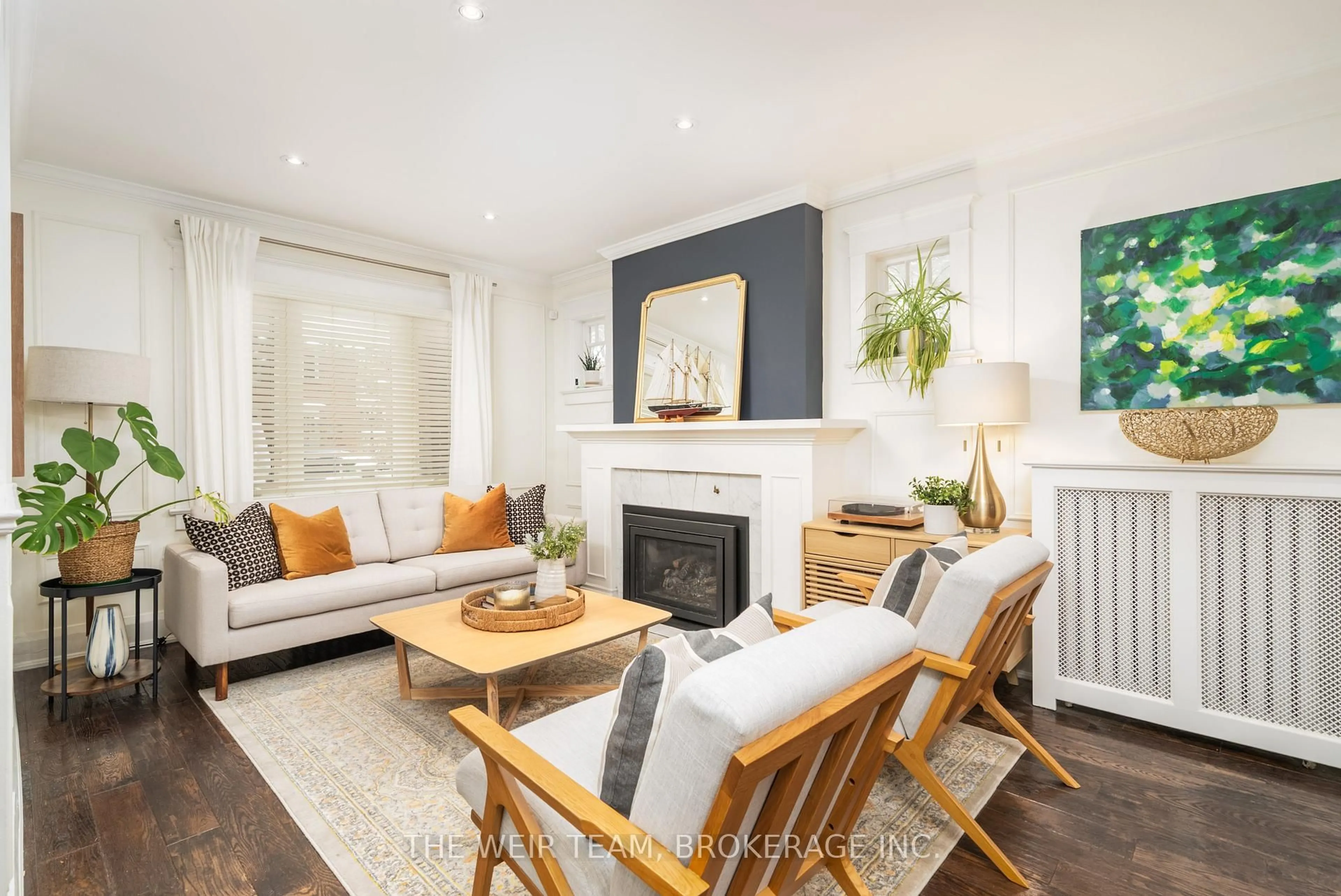 Living room with furniture, wood/laminate floor for 31 Glenmount Park Rd, Toronto Ontario M4E 2M8