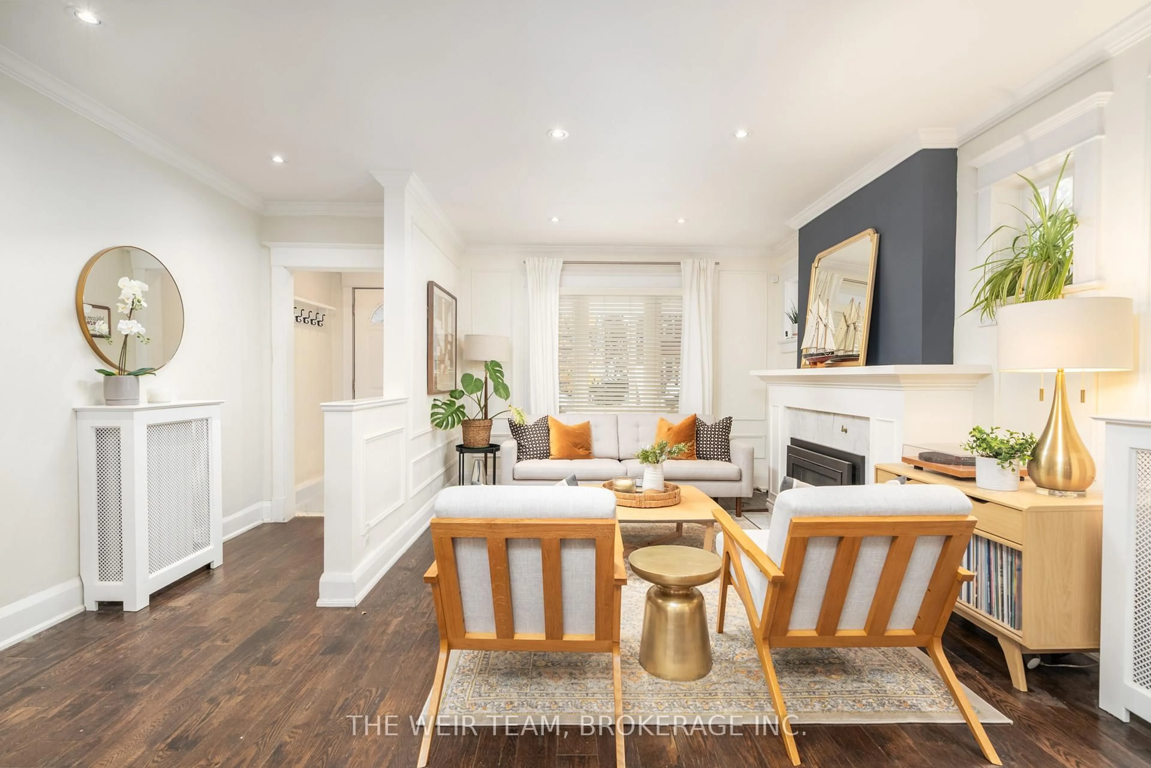 Living room with furniture, wood/laminate floor for 31 Glenmount Park Rd, Toronto Ontario M4E 2M8