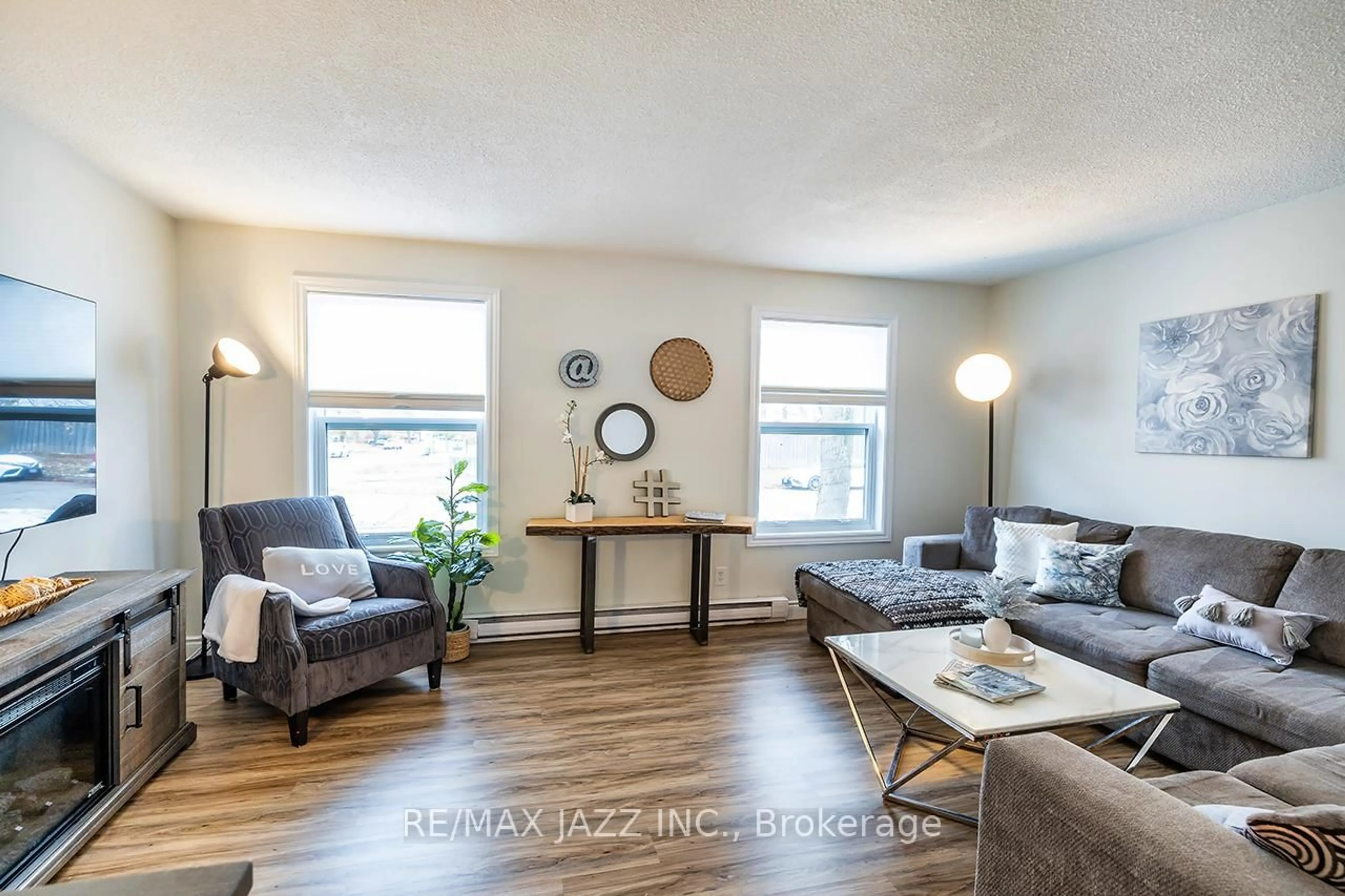 Living room with furniture, wood/laminate floor for 620 Dorchester Dr, Oshawa Ontario L1J 6L5