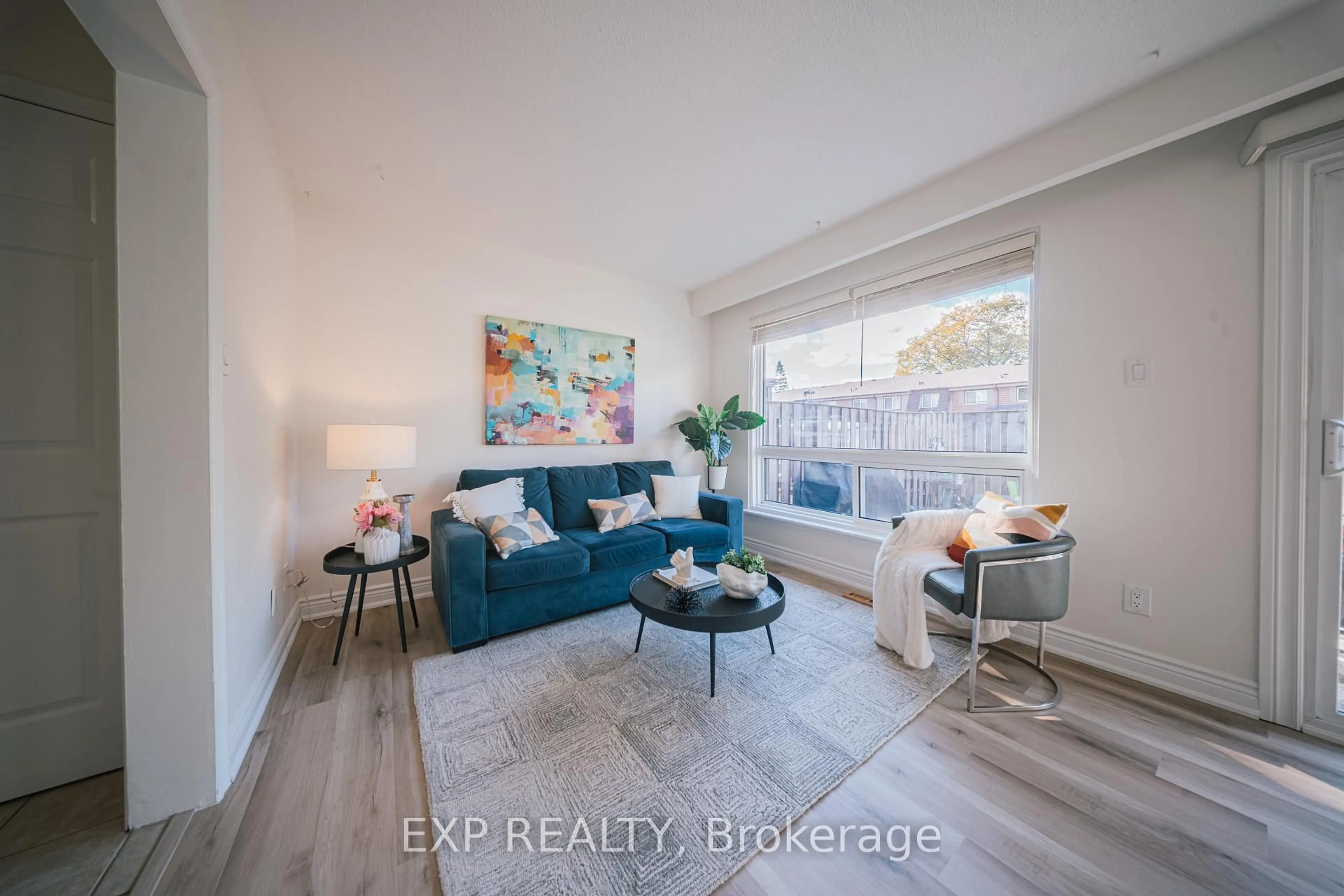 Living room with furniture, wood/laminate floor for 9 Michael Blvd #42, Whitby Ontario L1N 5P4