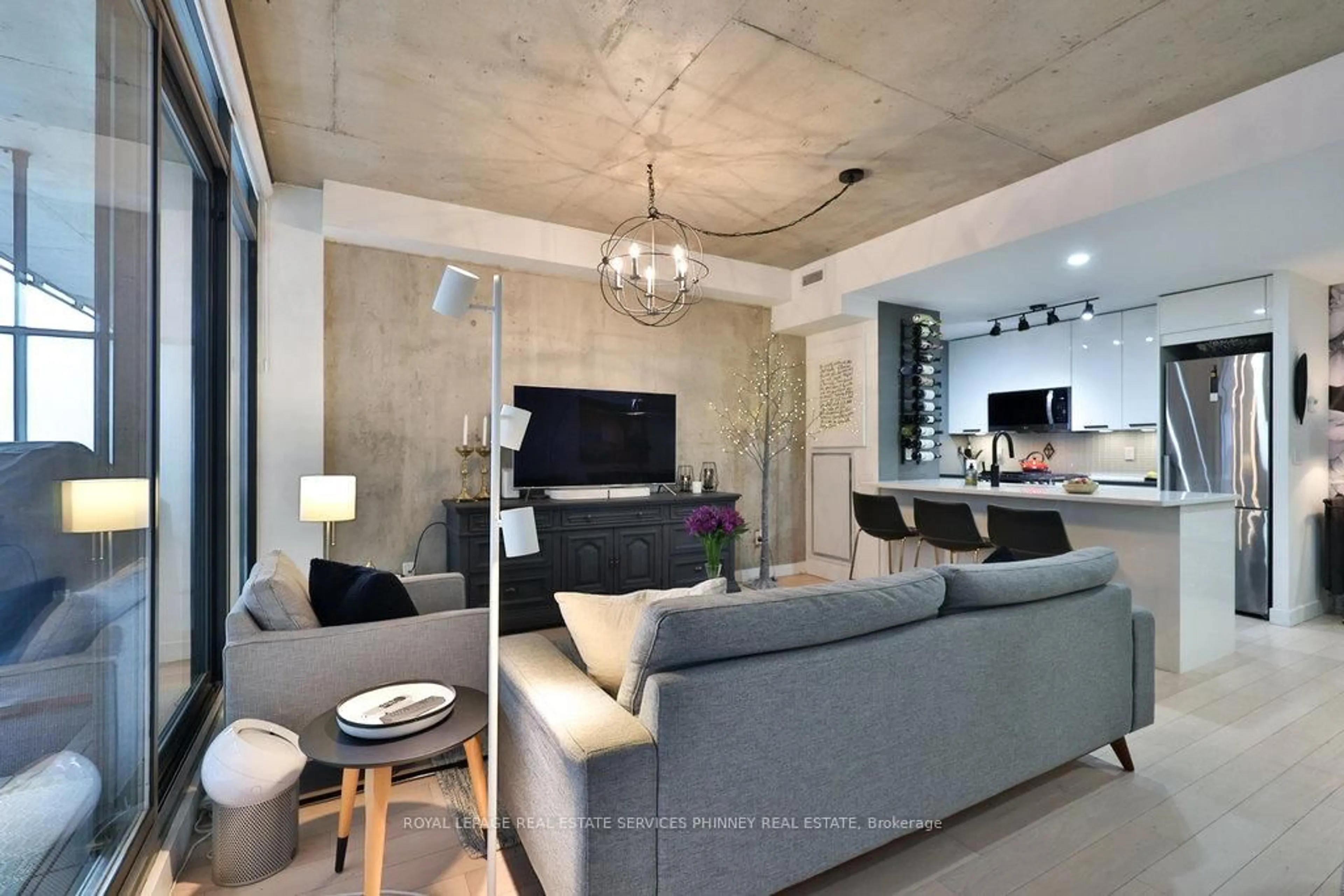 Living room with furniture, cement floor for 90 Broadview Ave #LW08, Toronto Ontario M4M 0A7