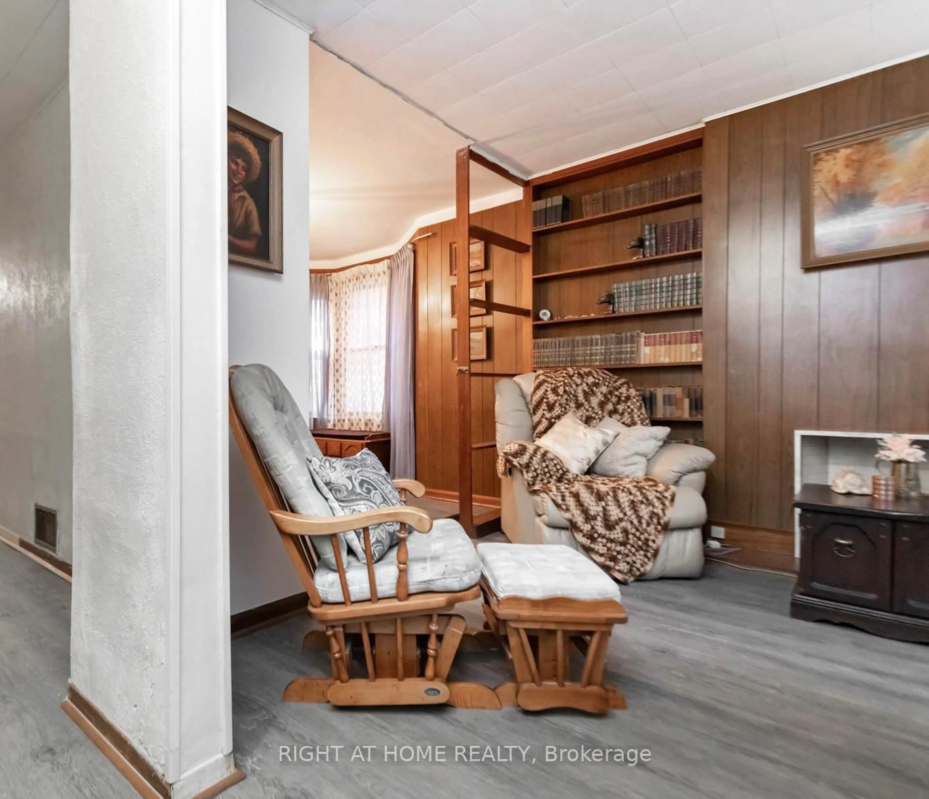 Living room with furniture, wood/laminate floor for 18 Mallon Ave, Toronto Ontario M4M 1P8