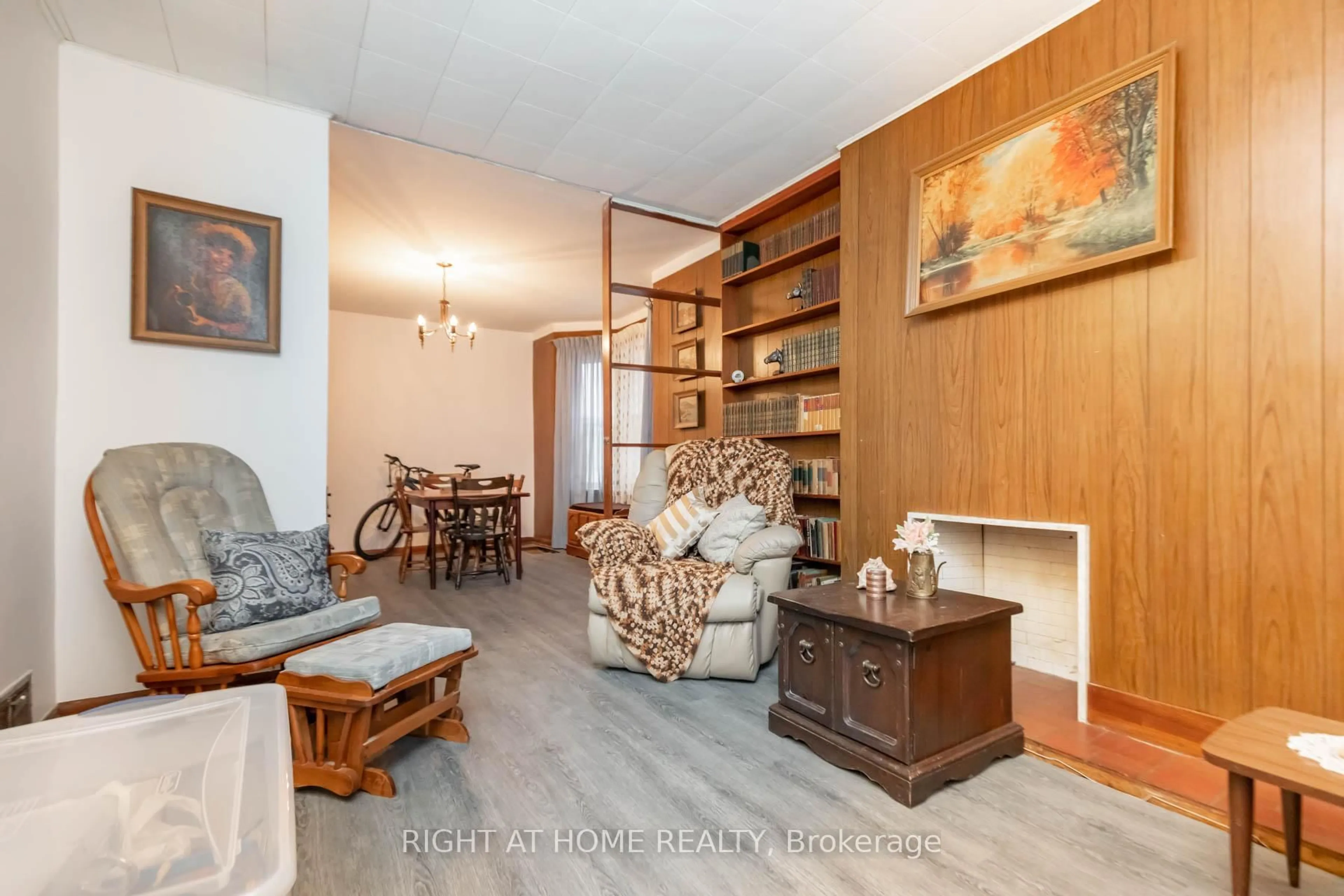 Living room with furniture, wood/laminate floor for 18 Mallon Ave, Toronto Ontario M4M 1P8