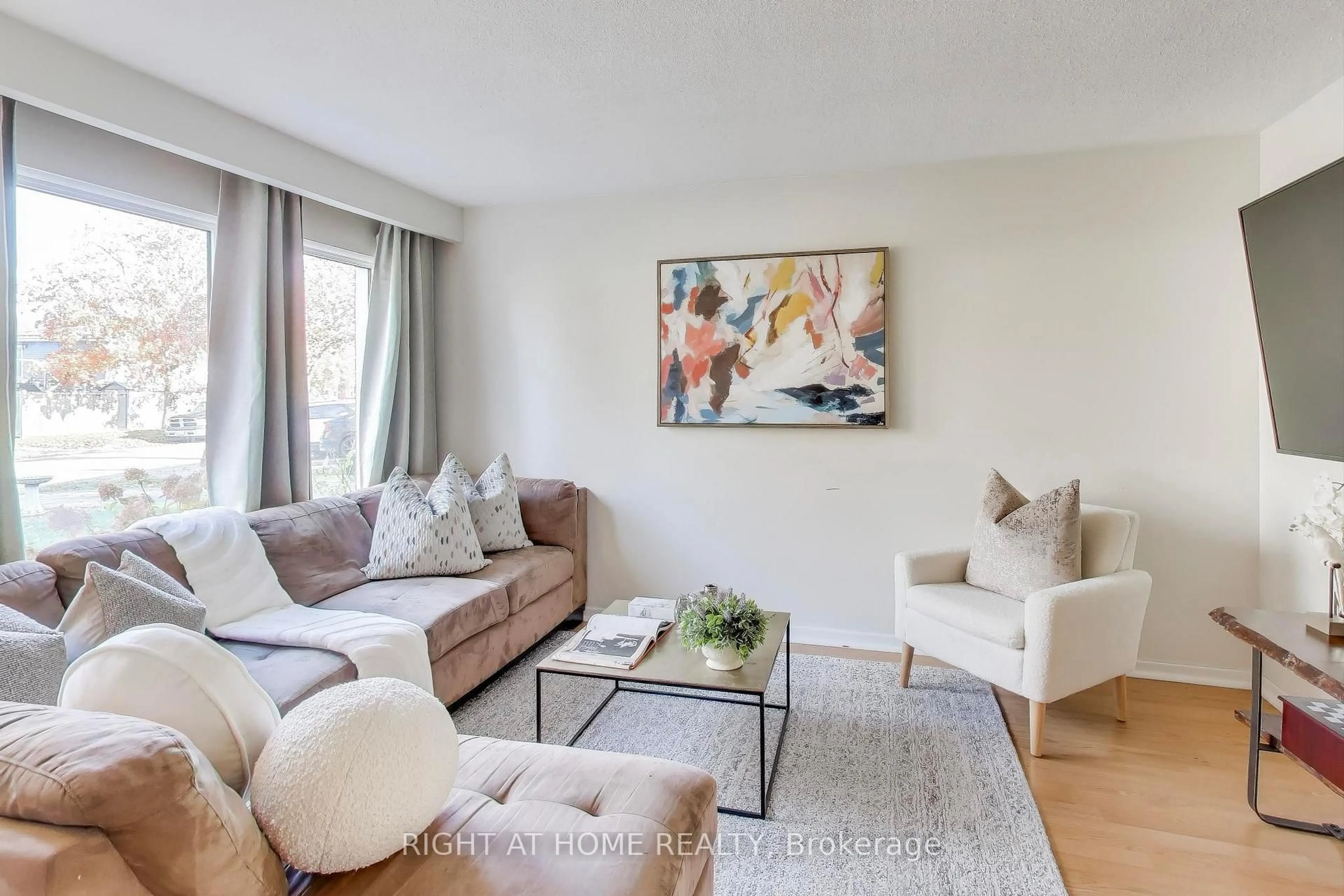 Living room with furniture, wood/laminate floor for 408 Camelot Crt, Oshawa Ontario L1G 6P7