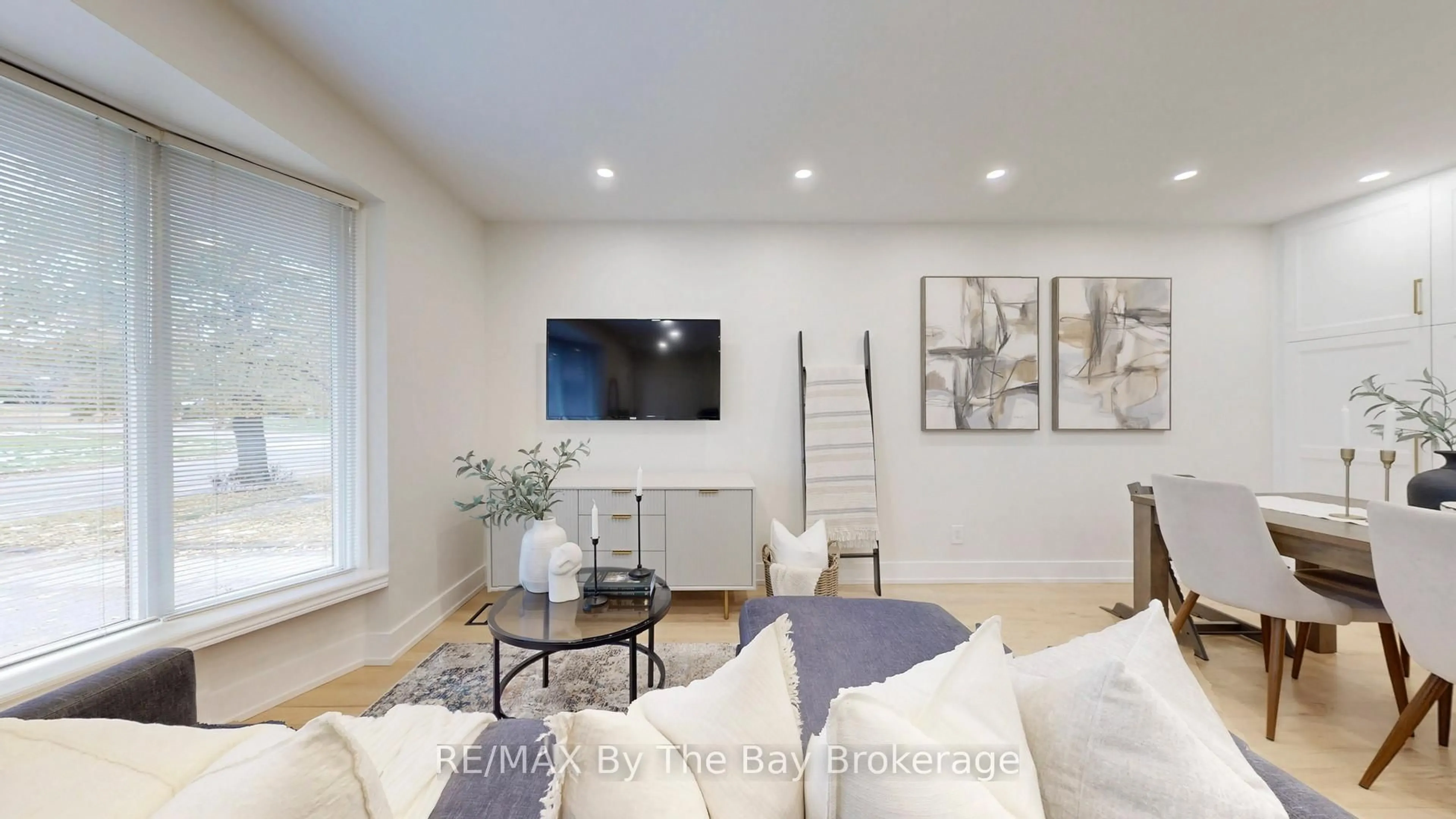 Living room with furniture, wood/laminate floor for 82 Brimorton Dr, Toronto Ontario M1P 3Z5