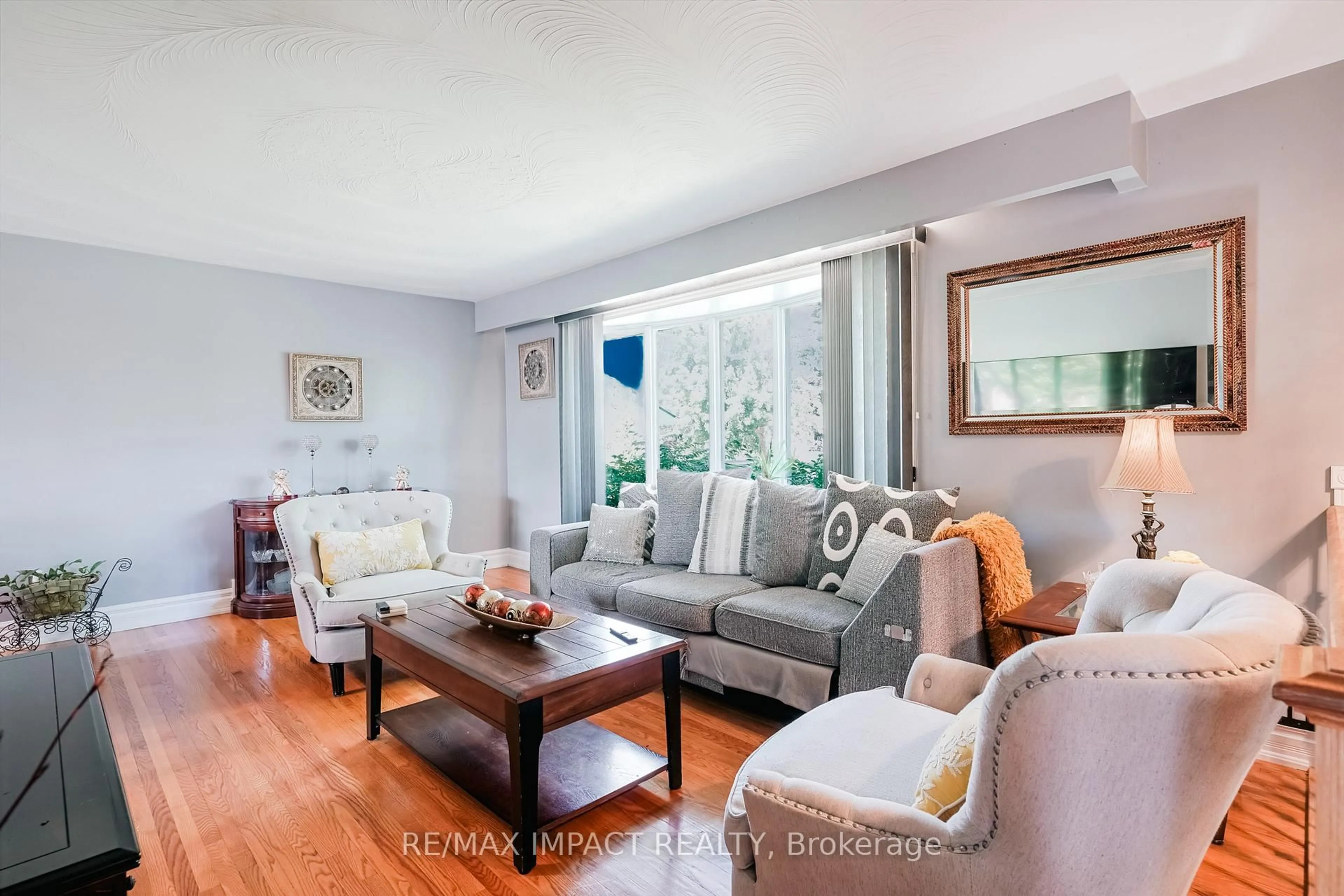 Living room with furniture, wood/laminate floor for 415 Jane Ave, Oshawa Ontario L1J 3L6