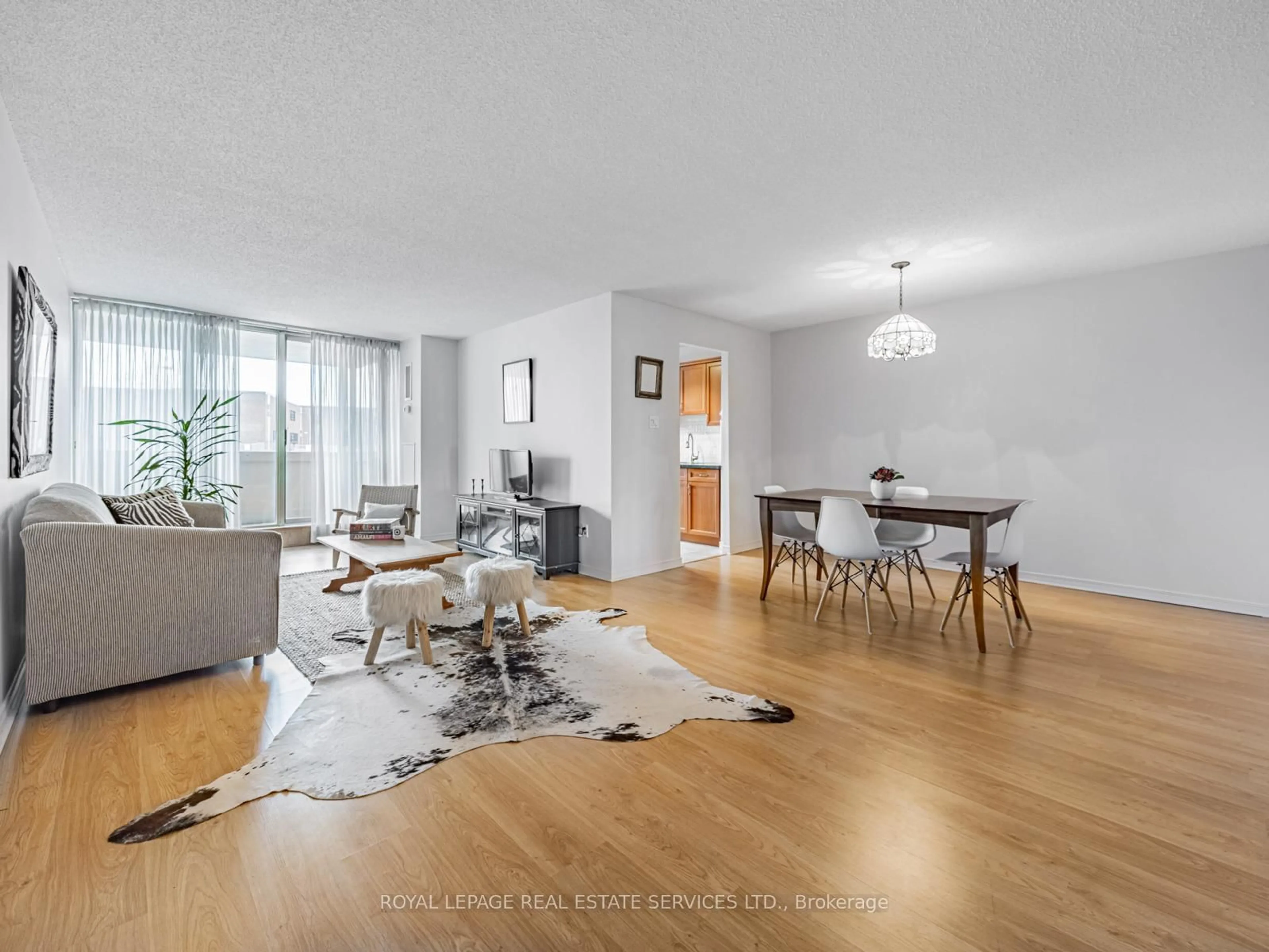 Living room with furniture, wood/laminate floor for 44 Falby Crt #205, Ajax Ontario L1S 3L1