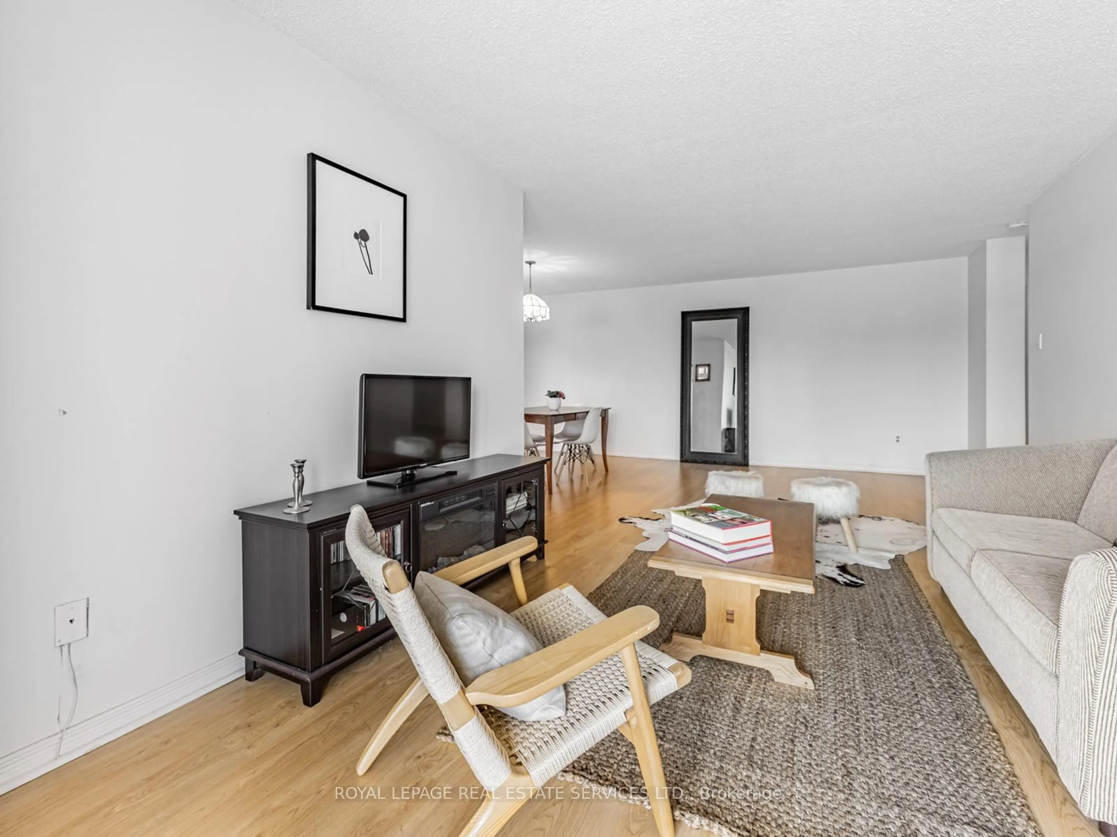 Living room with furniture, wood/laminate floor for 44 Falby Crt #205, Ajax Ontario L1S 3L1