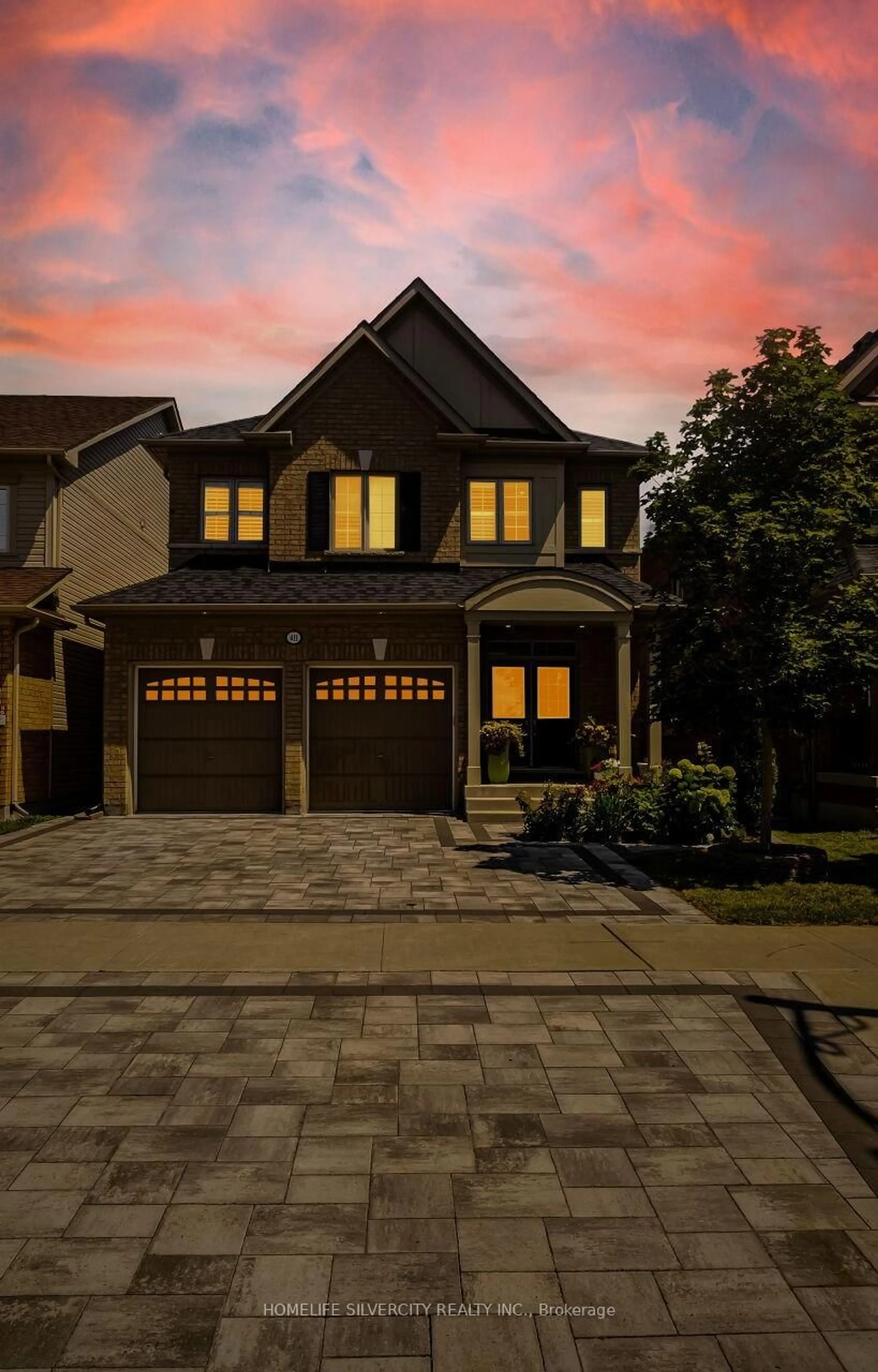 Home with brick exterior material, street for 411 Windfields Farm Dr, Oshawa Ontario L1L 0M1