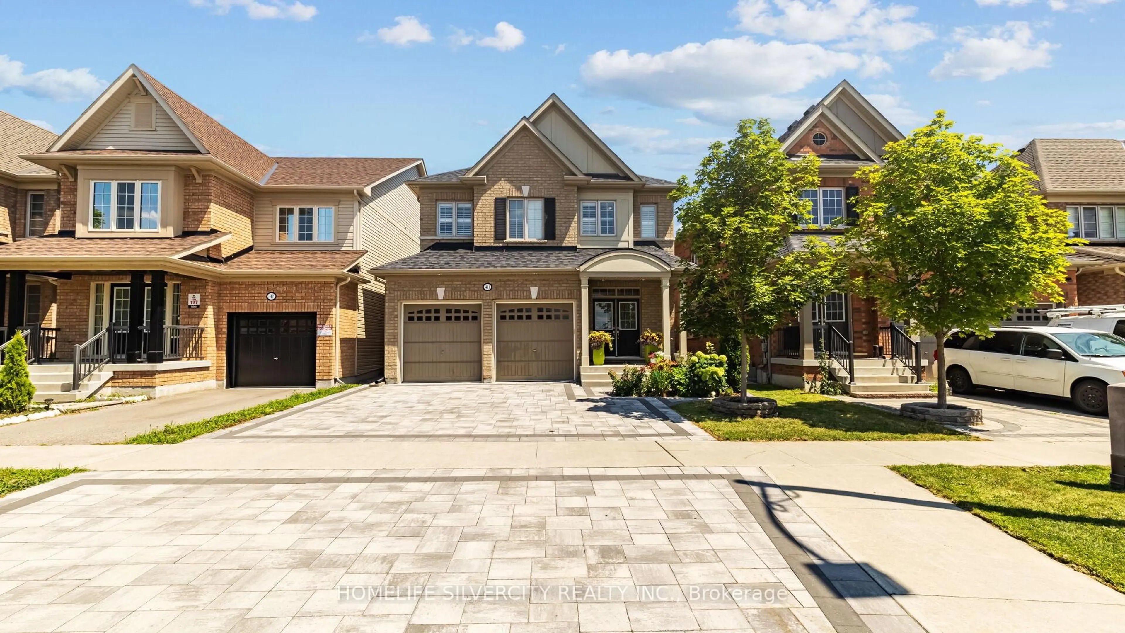 Home with brick exterior material, street for 411 Windfields Farm Dr, Oshawa Ontario L1L 0M1