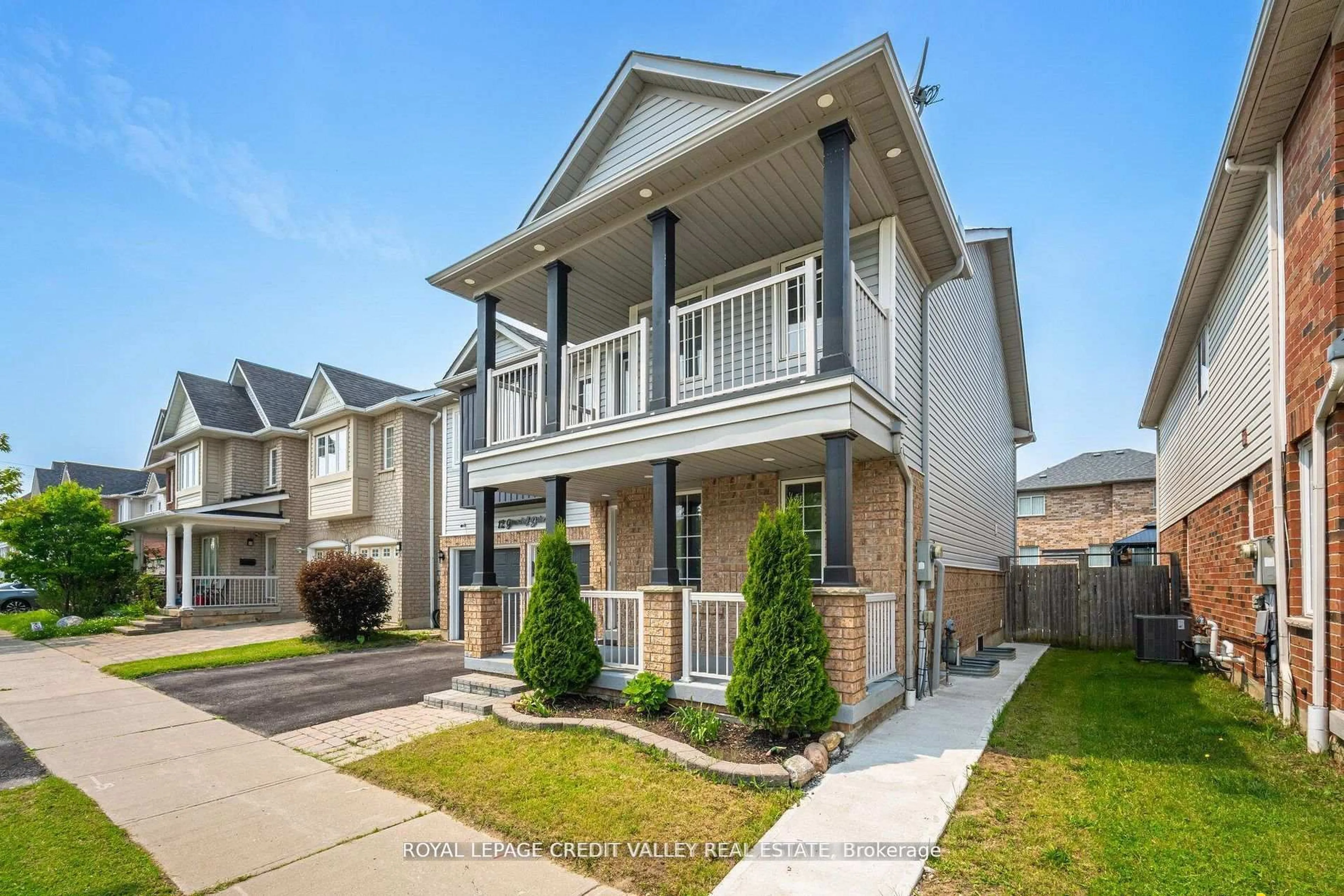 Home with vinyl exterior material, street for 12 Greenhalf Dr, Ajax Ontario L1S 7N6