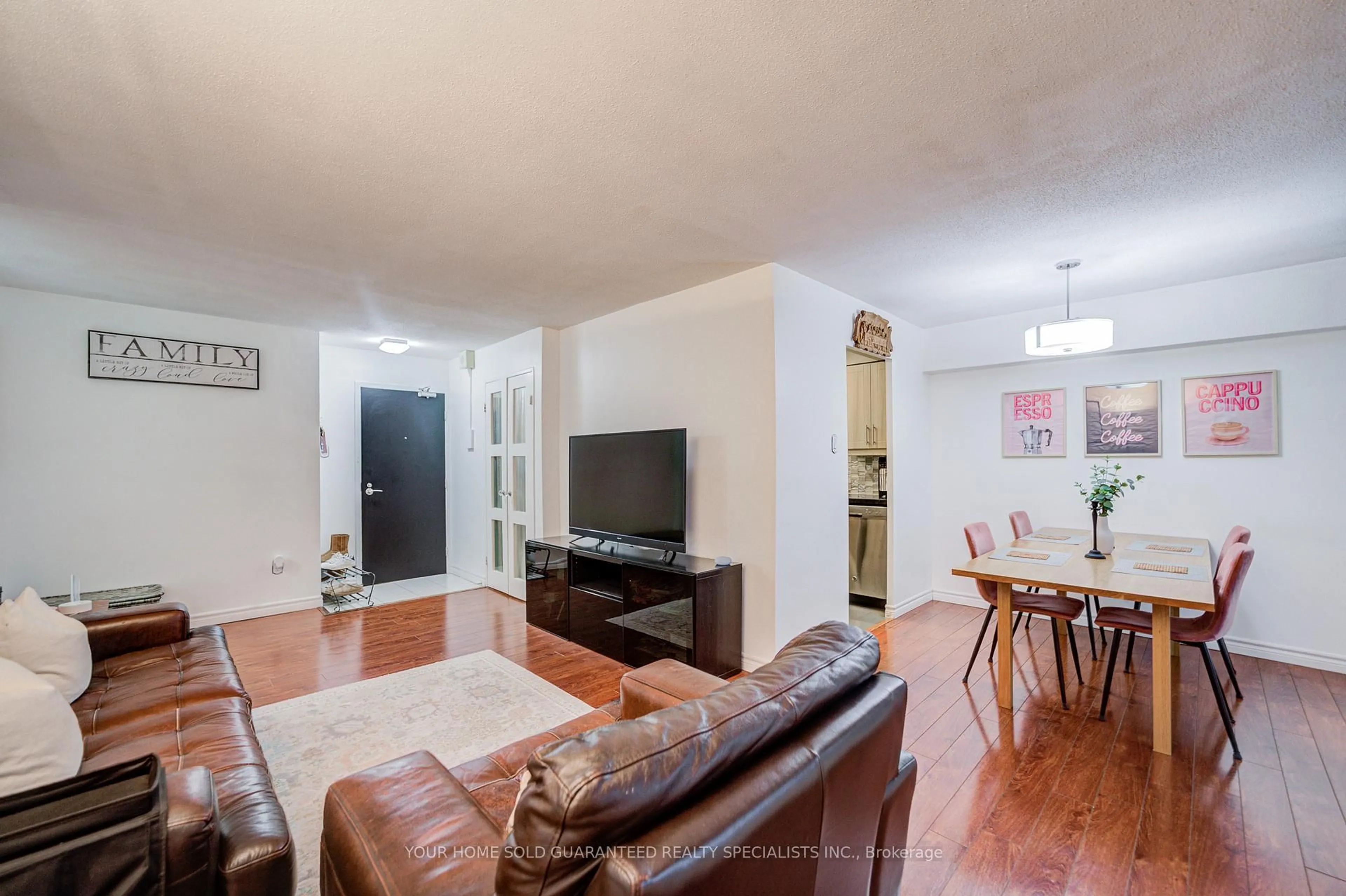 Living room with furniture, wood/laminate floor for 2721 Victoria Park Ave #602, Toronto Ontario M1T 3N6