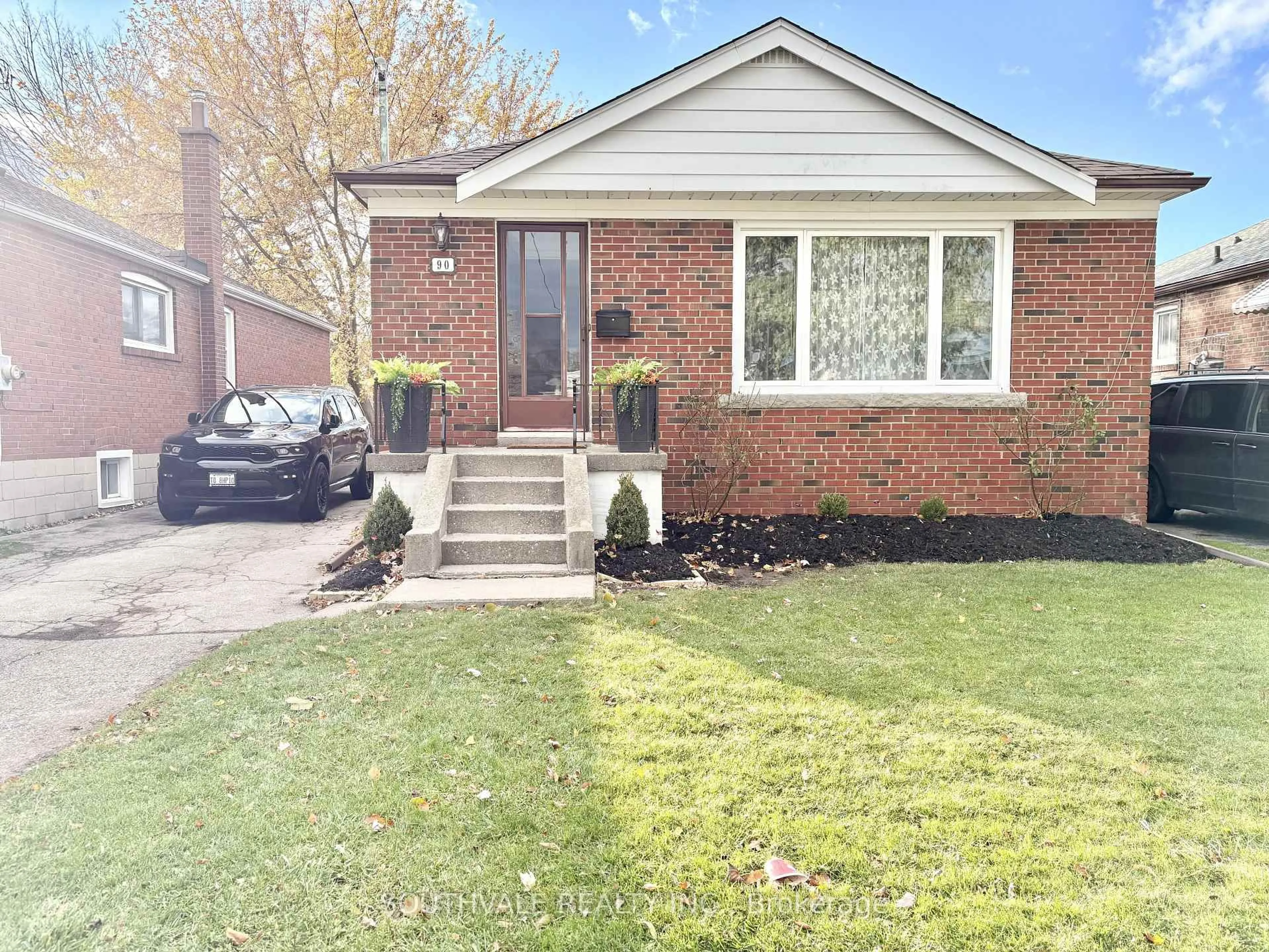Home with brick exterior material, street for 90 Trinnell Blvd, Toronto Ontario M1L 1S7