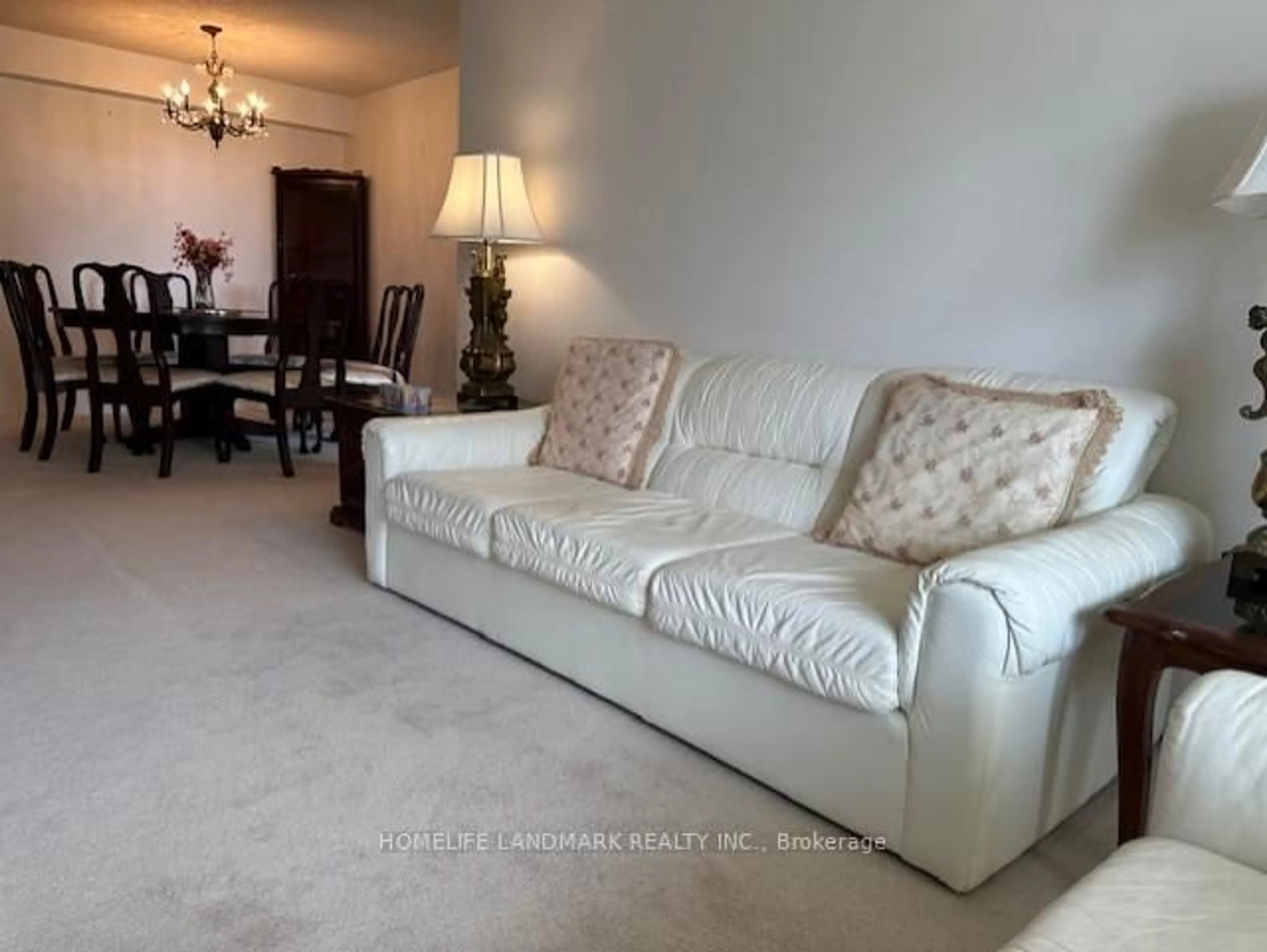 Living room with furniture, carpet floor for 225 Bamburgh Circ #711, Toronto Ontario M1W 3X9