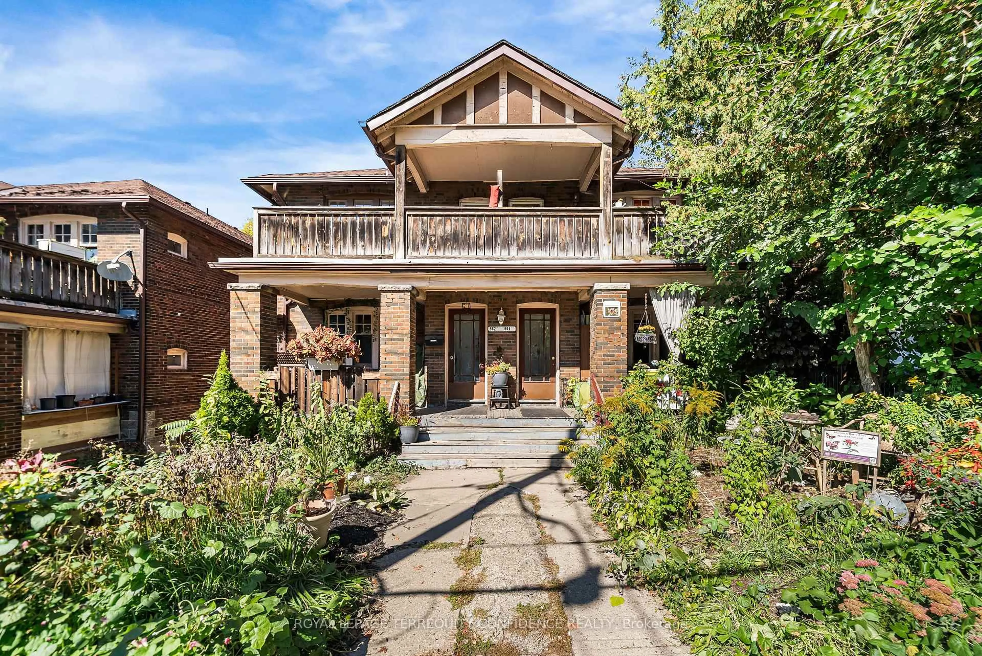 Home with brick exterior material, street for 558-562 Kingston Rd, Toronto Ontario M4E 1P9