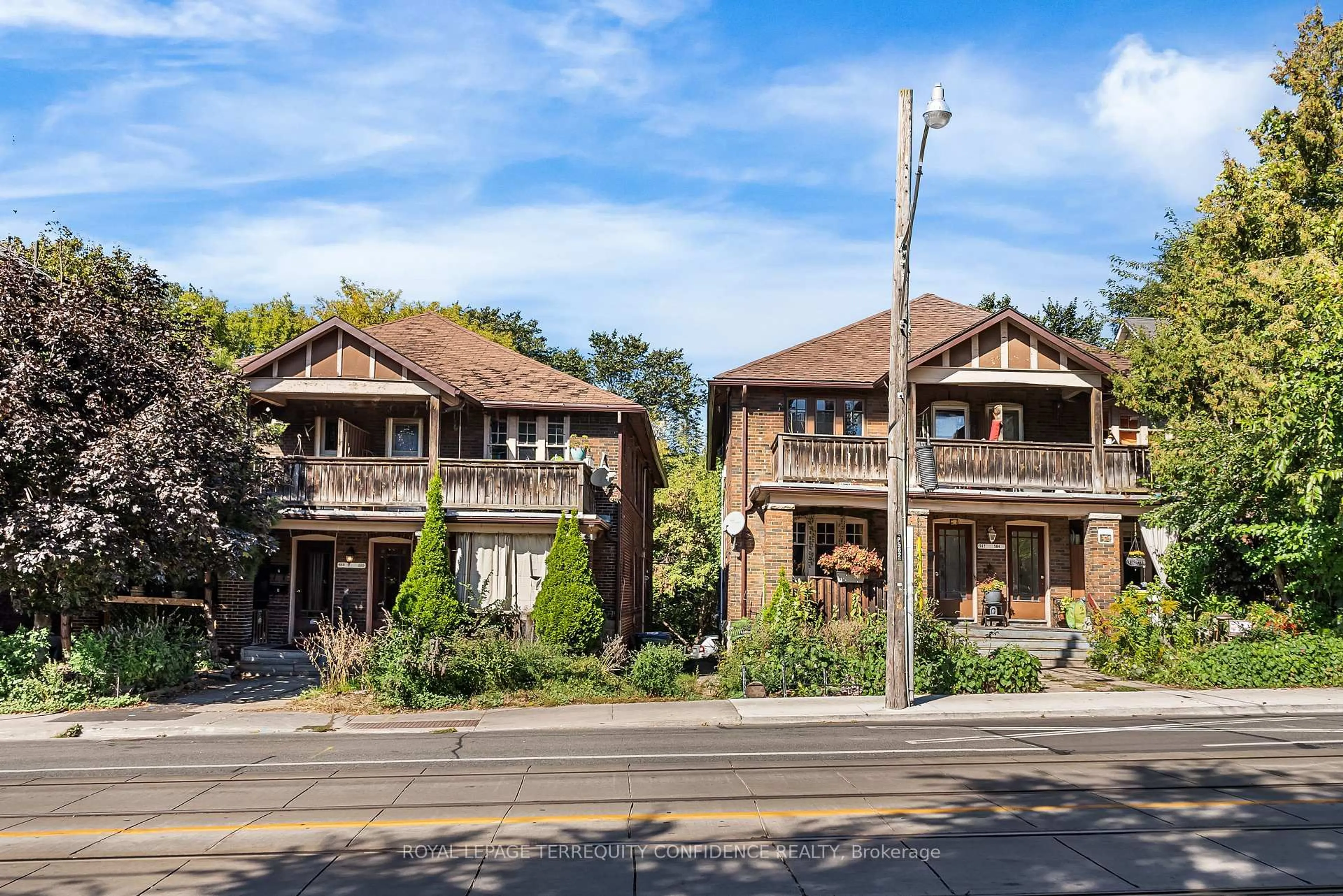 Home with brick exterior material, street for 558-562 Kingston Rd, Toronto Ontario M4E 1P9