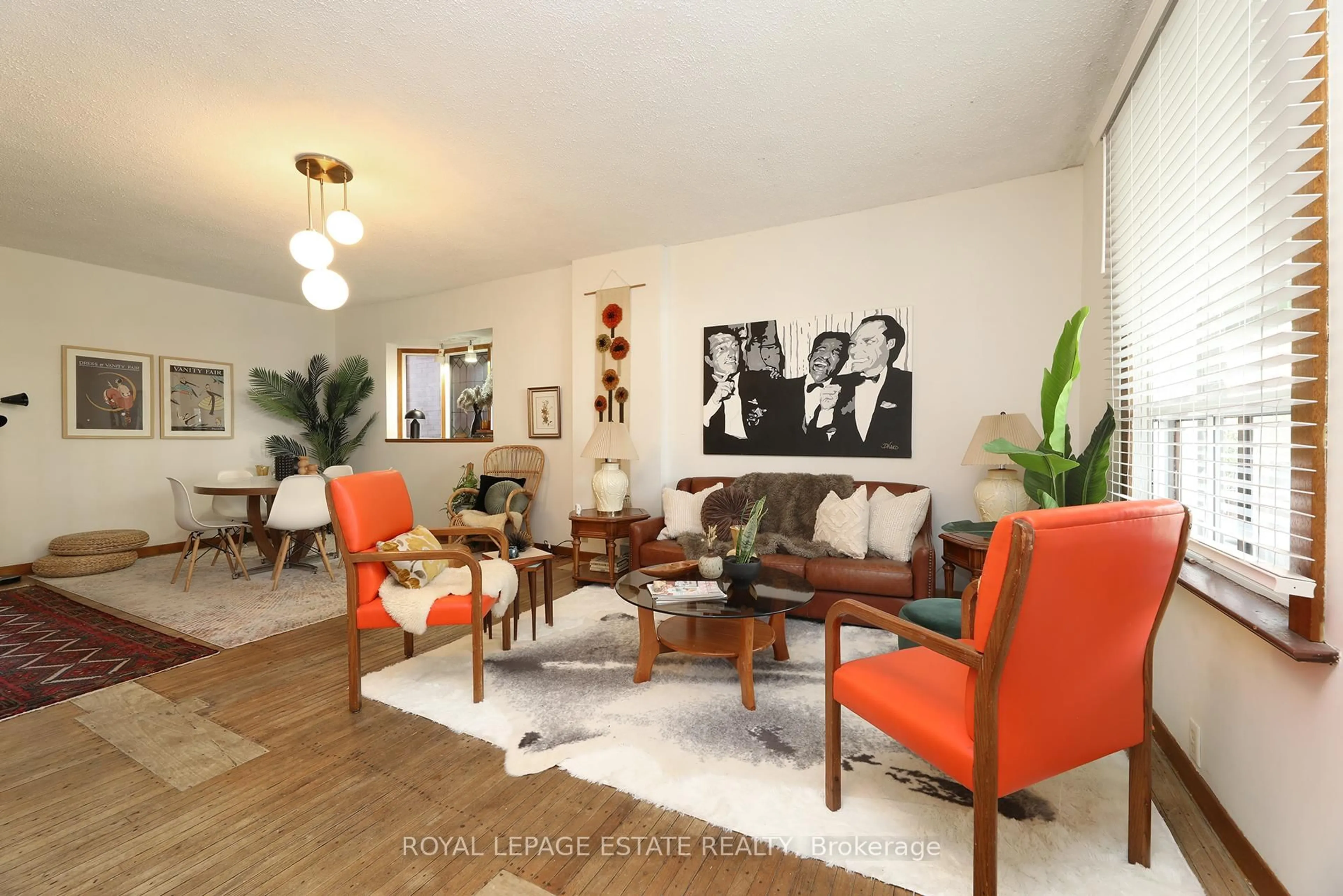 Living room with furniture, wood/laminate floor for 22 Galt Ave, Toronto Ontario M4M 2Z1