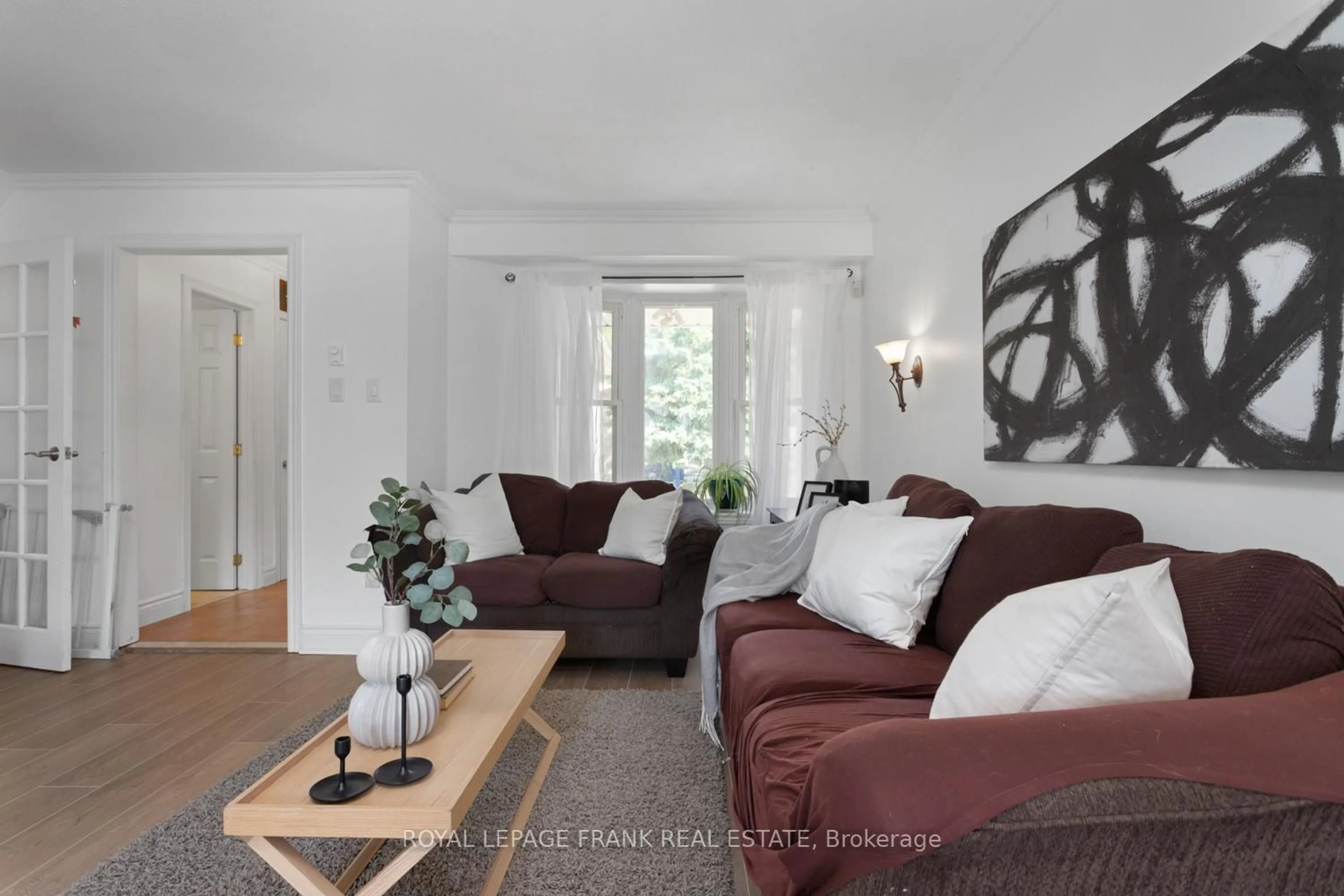 Living room with furniture, wood/laminate floor for 700 Harmony Rd #42, Oshawa Ontario L1K 1S2