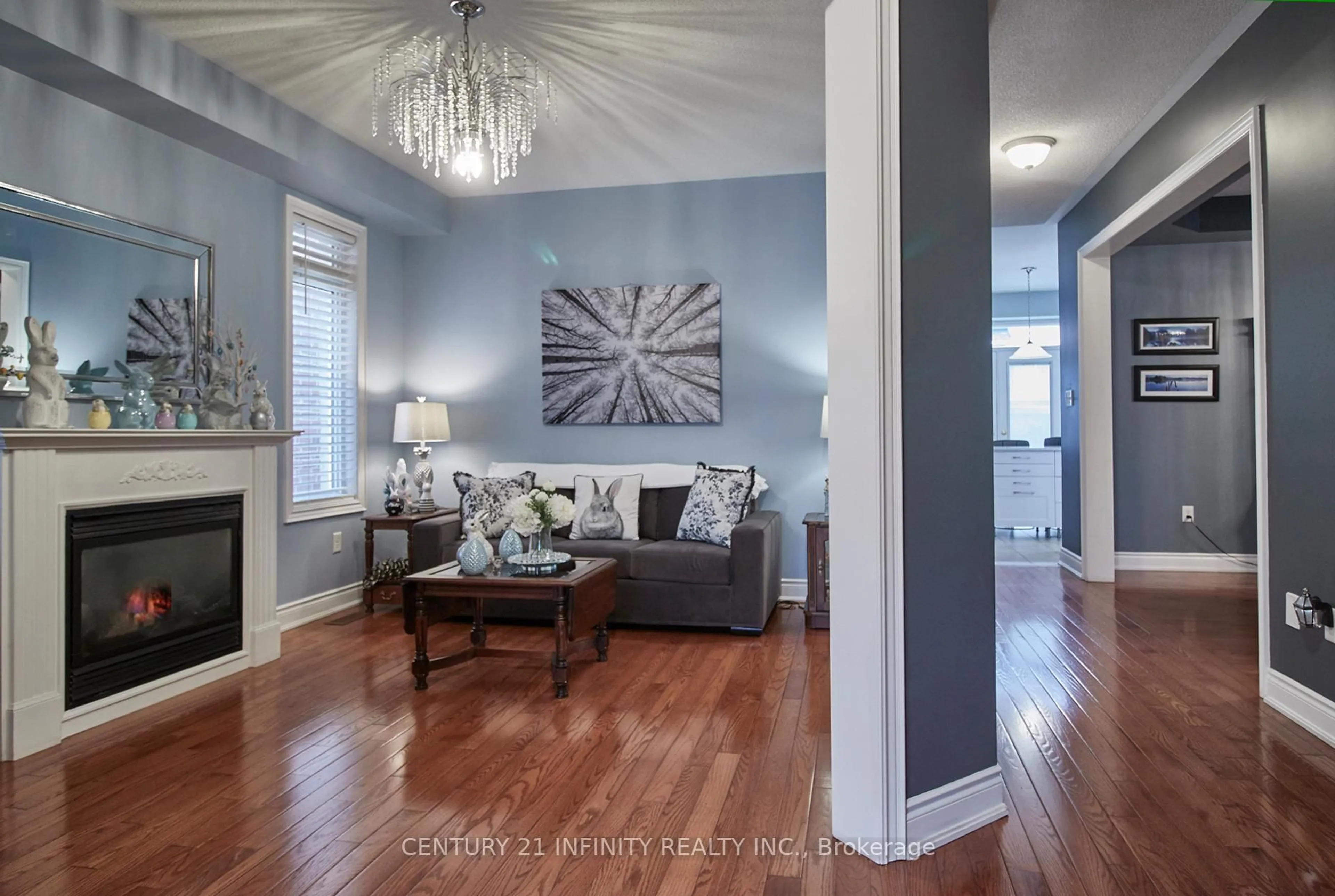 Living room with furniture, wood/laminate floor for 1599 Quail Run Dr, Oshawa Ontario L1K 0E1