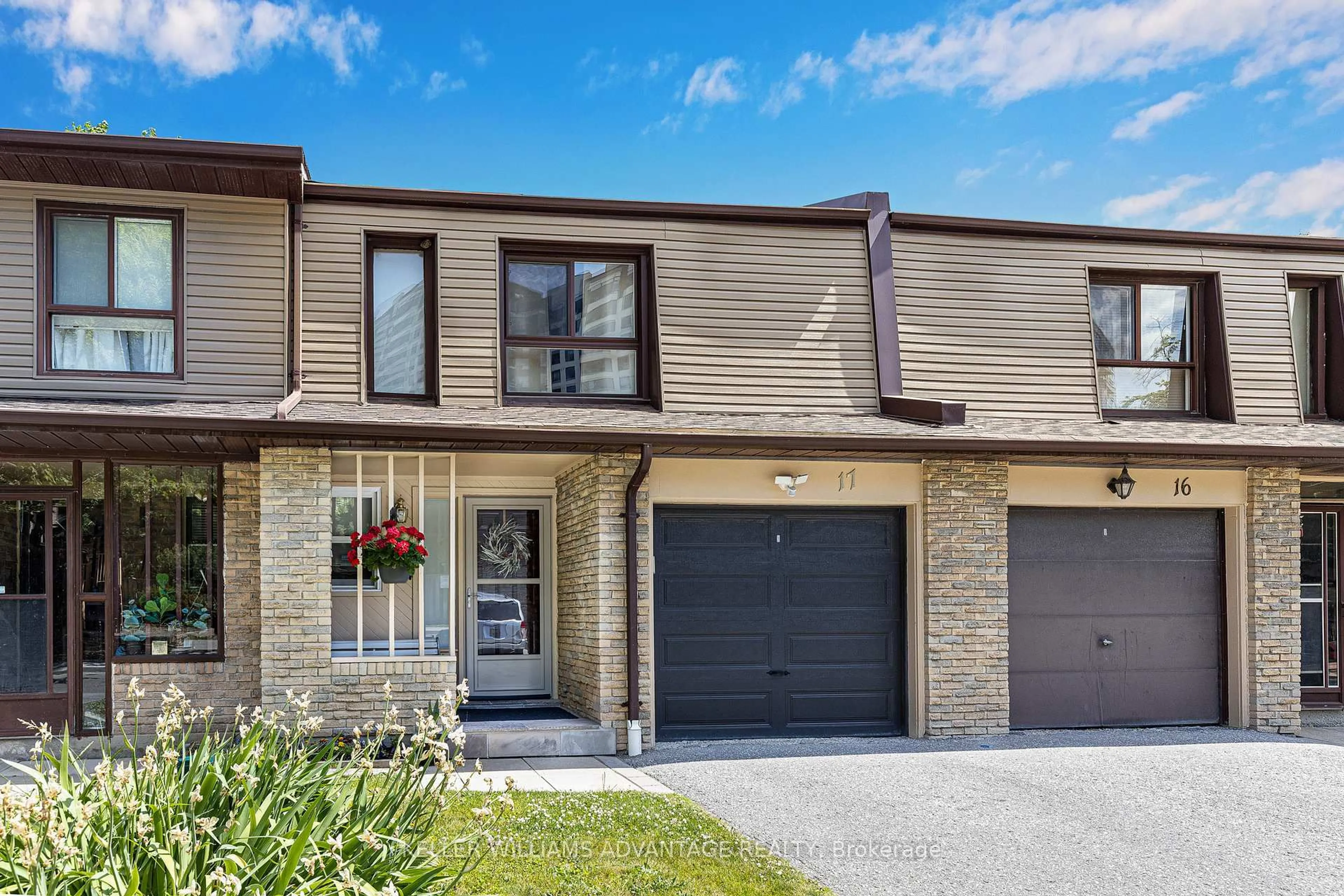 Home with brick exterior material, street for 1051 Sandhurst Circ #17, Toronto Ontario M1V 1T9
