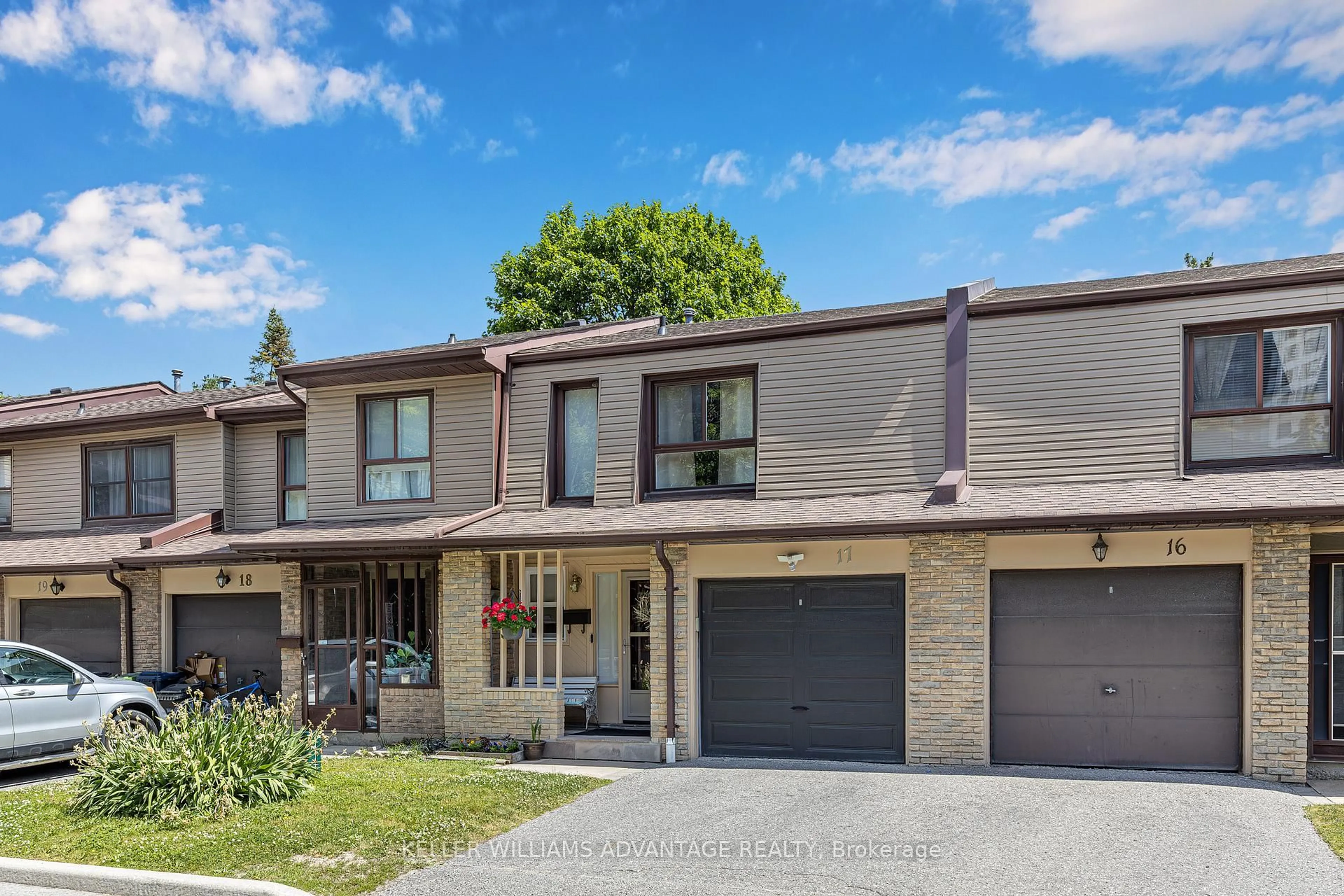 Home with brick exterior material, street for 1051 Sandhurst Circ #17, Toronto Ontario M1V 1T9