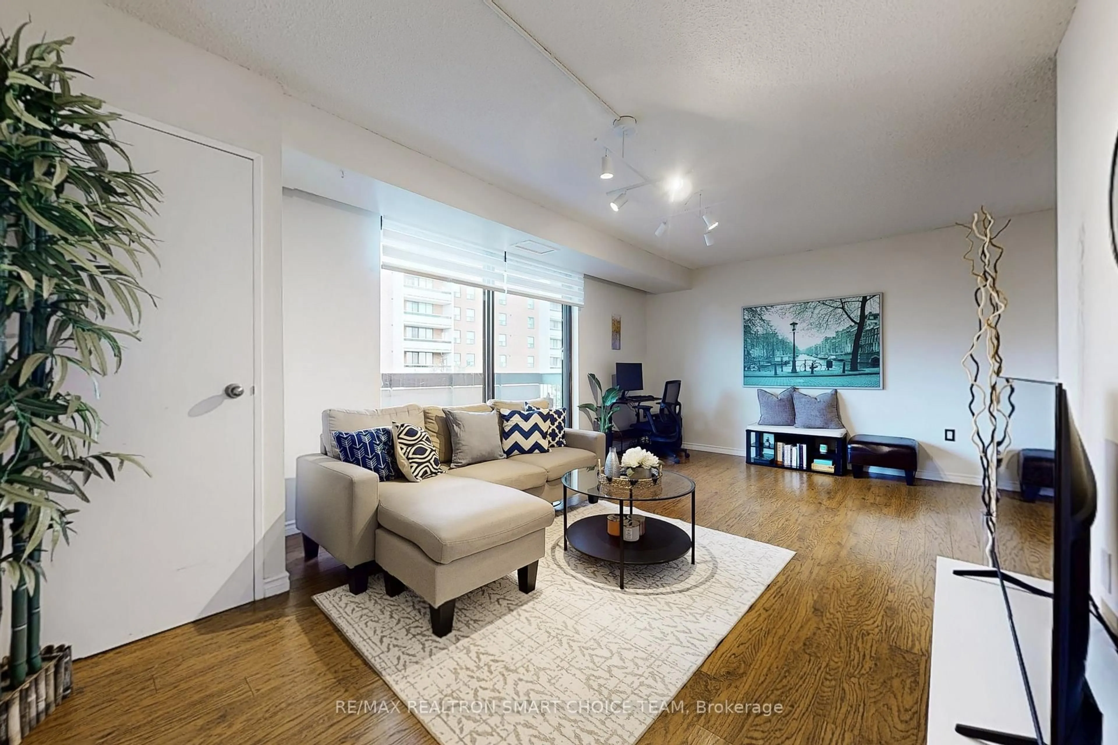 Living room with furniture, unknown for 1200 Bridletowne Circ #507, Toronto Ontario M1W 2H8