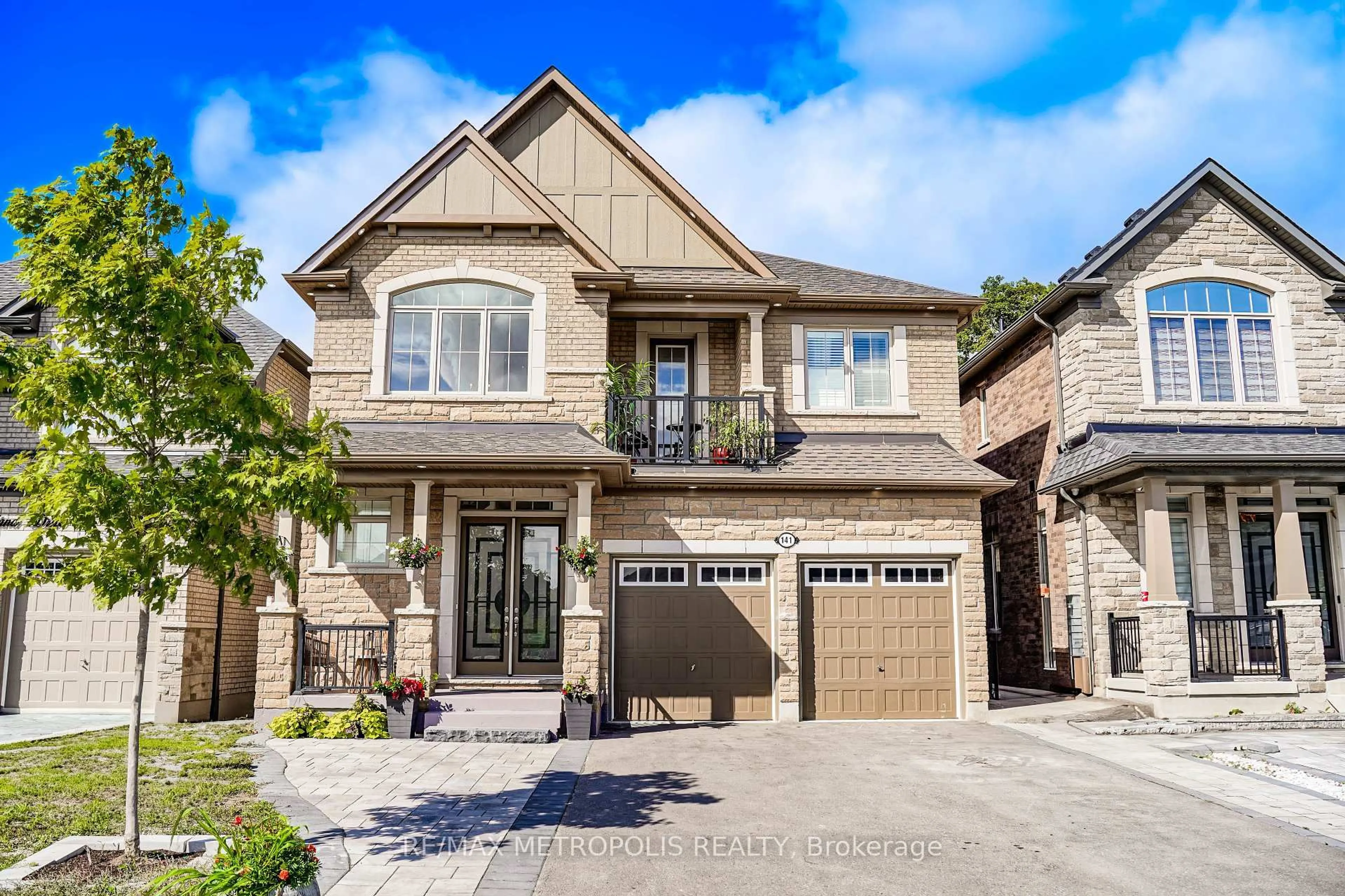 Home with brick exterior material, street for 141 AUCKLAND Dr, Whitby Ontario L1P 0J2