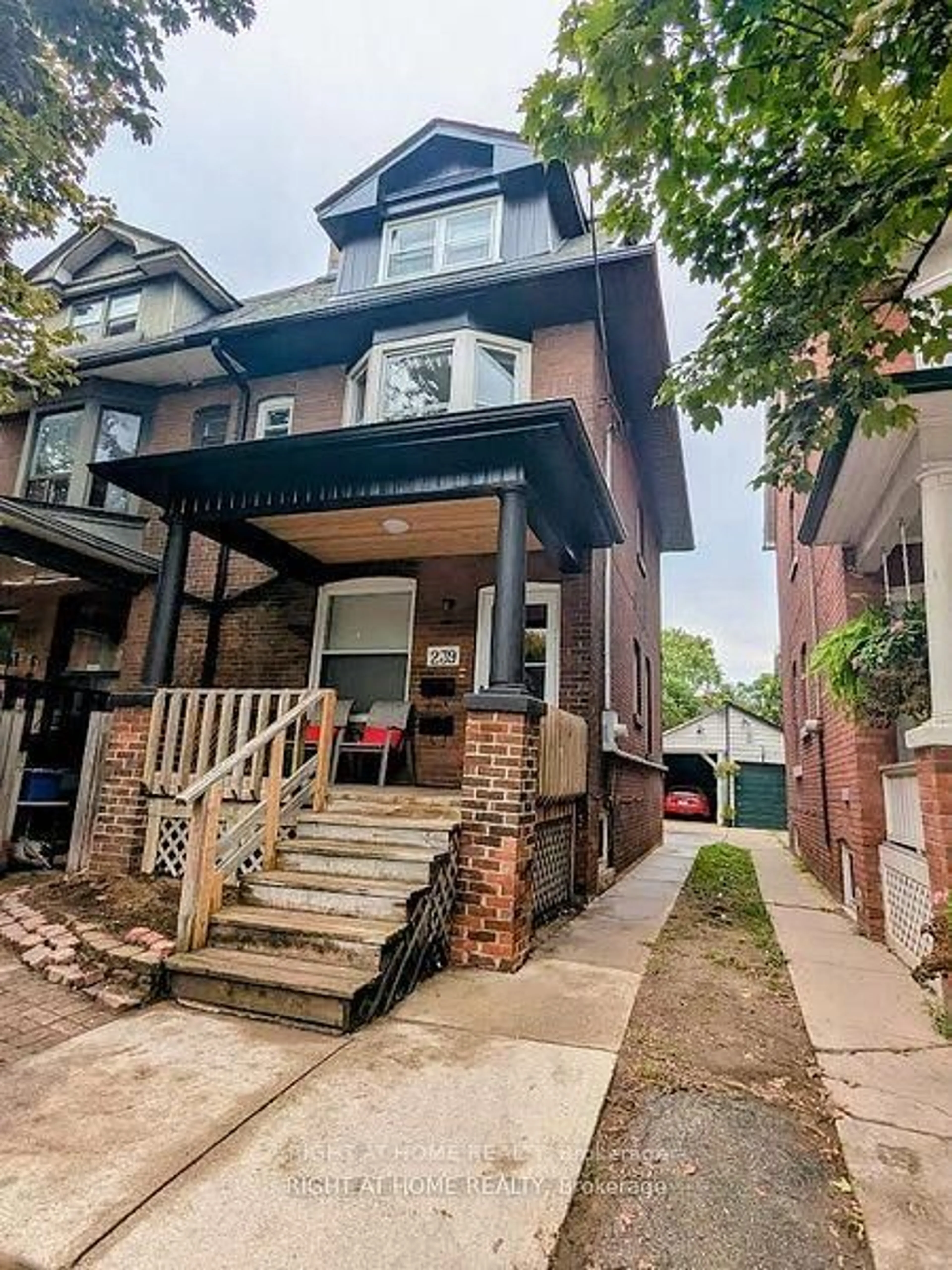 Home with brick exterior material, street for 239 Woodbine Ave, Toronto Ontario M4L 3P3