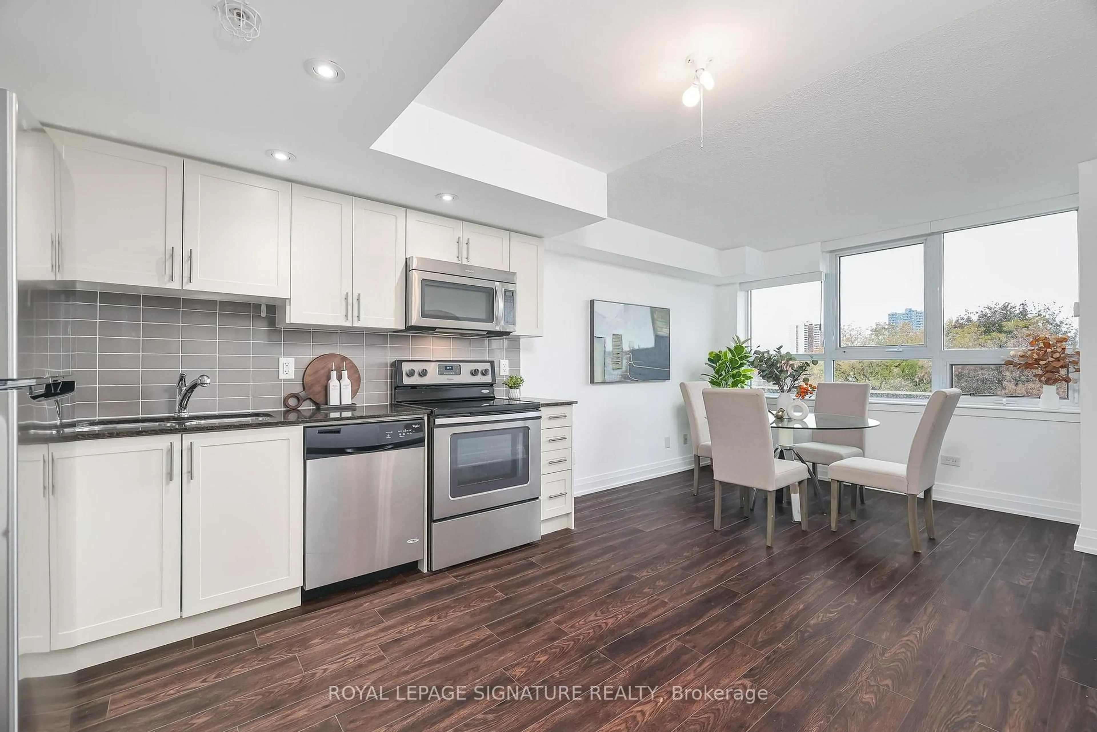Open concept kitchen, wood/laminate floor for 3520 Danforth Ave #502, Toronto Ontario M1L 1E5