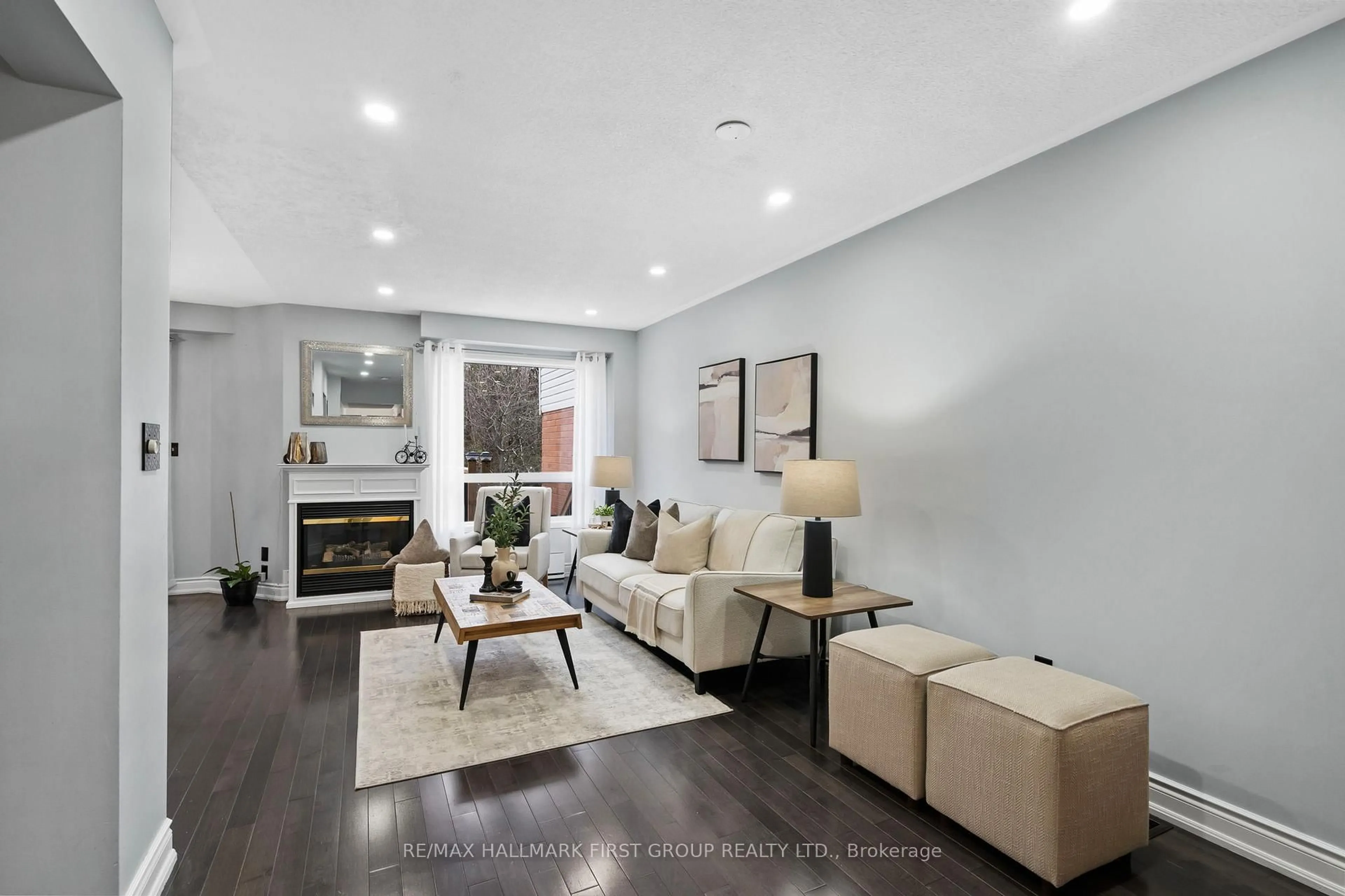 Living room with furniture, wood/laminate floor for 1696 Woodgate Tr, Oshawa Ontario L1G 8B4