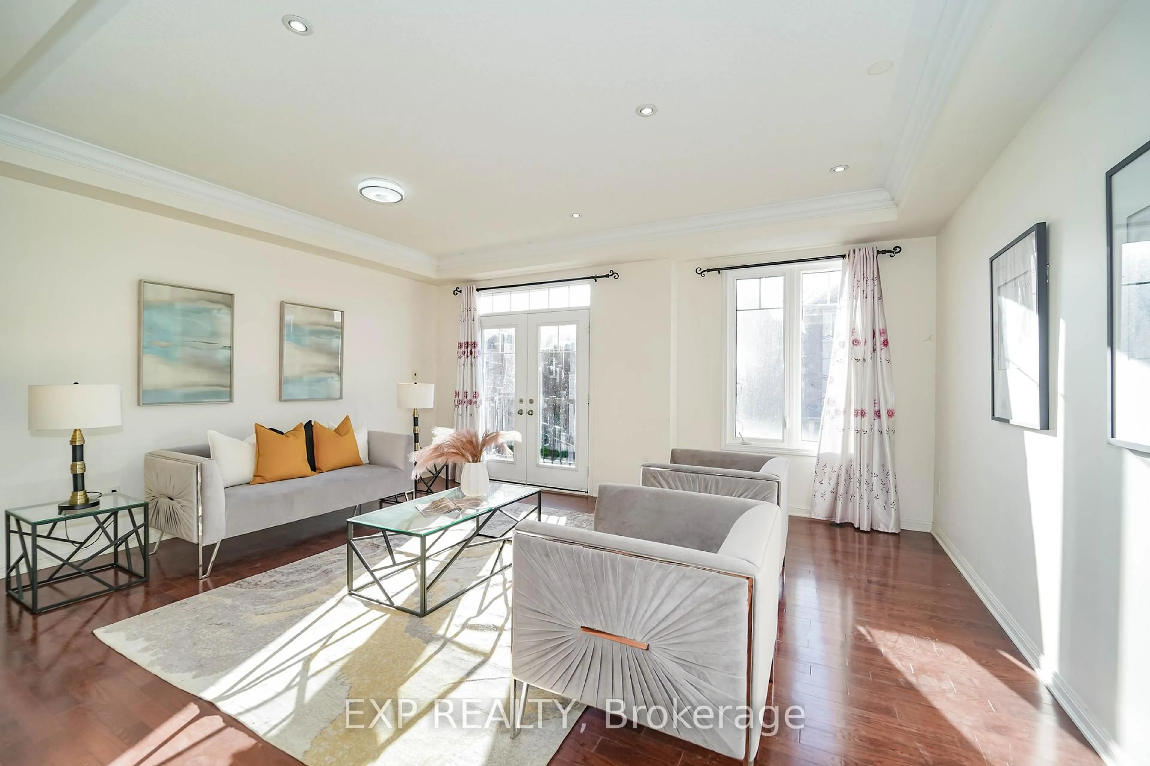 Living room with furniture, wood/laminate floor for 18 Winkler Terr, Toronto Ontario M1L 0C2