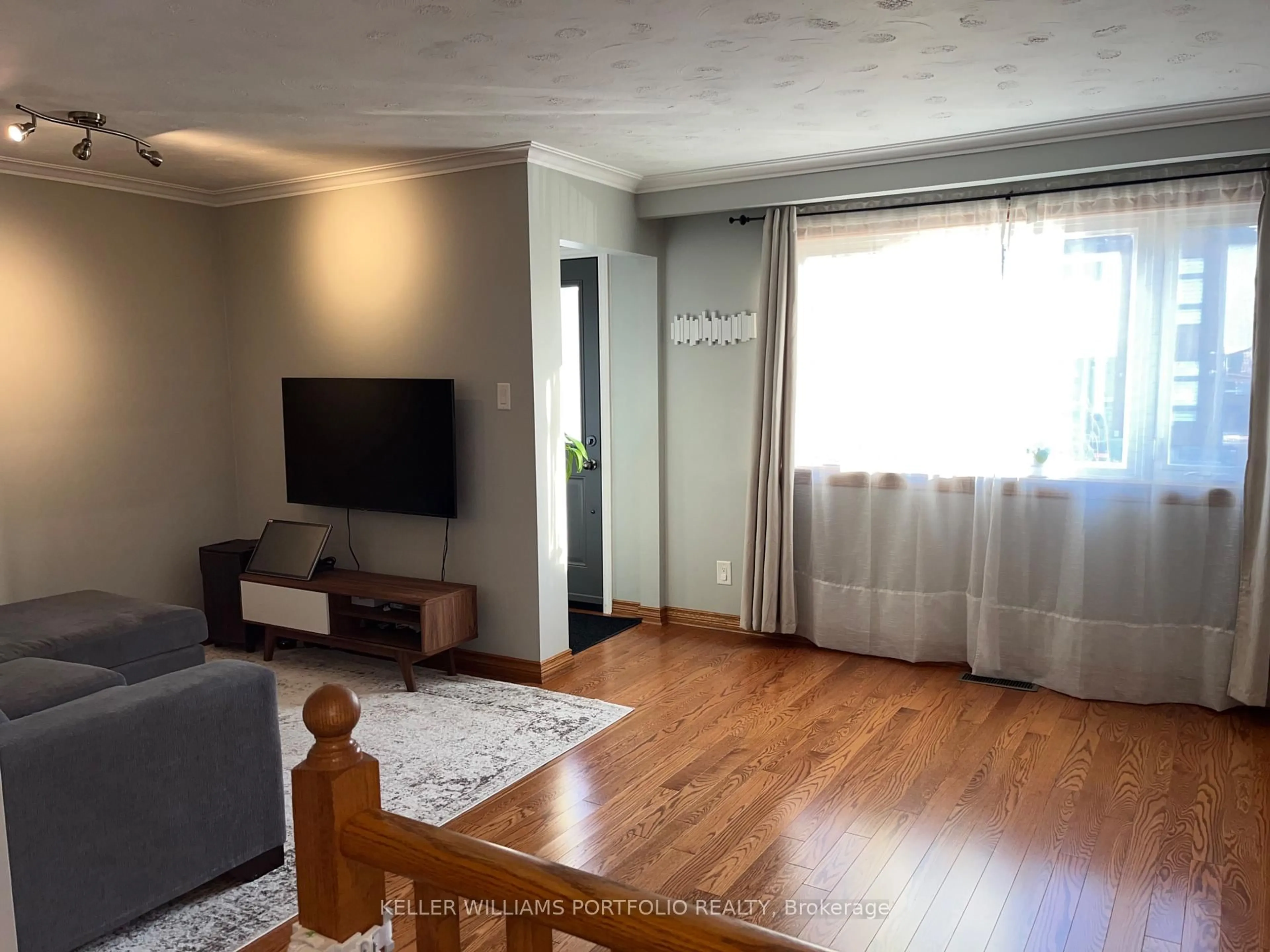 Living room with furniture, wood/laminate floor for 50 Butterworth Ave, Toronto Ontario M1L 1H5