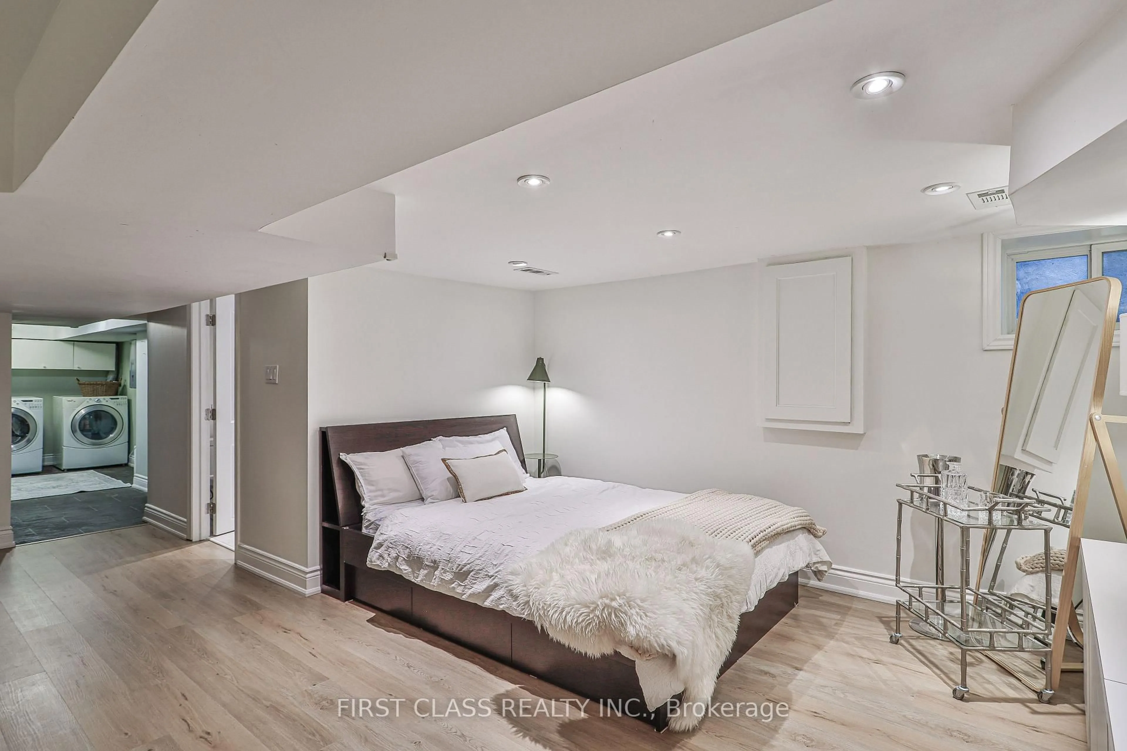 Bedroom with bed, wood/laminate floor for 14 Herbert Ave, Toronto Ontario M4L 3P9