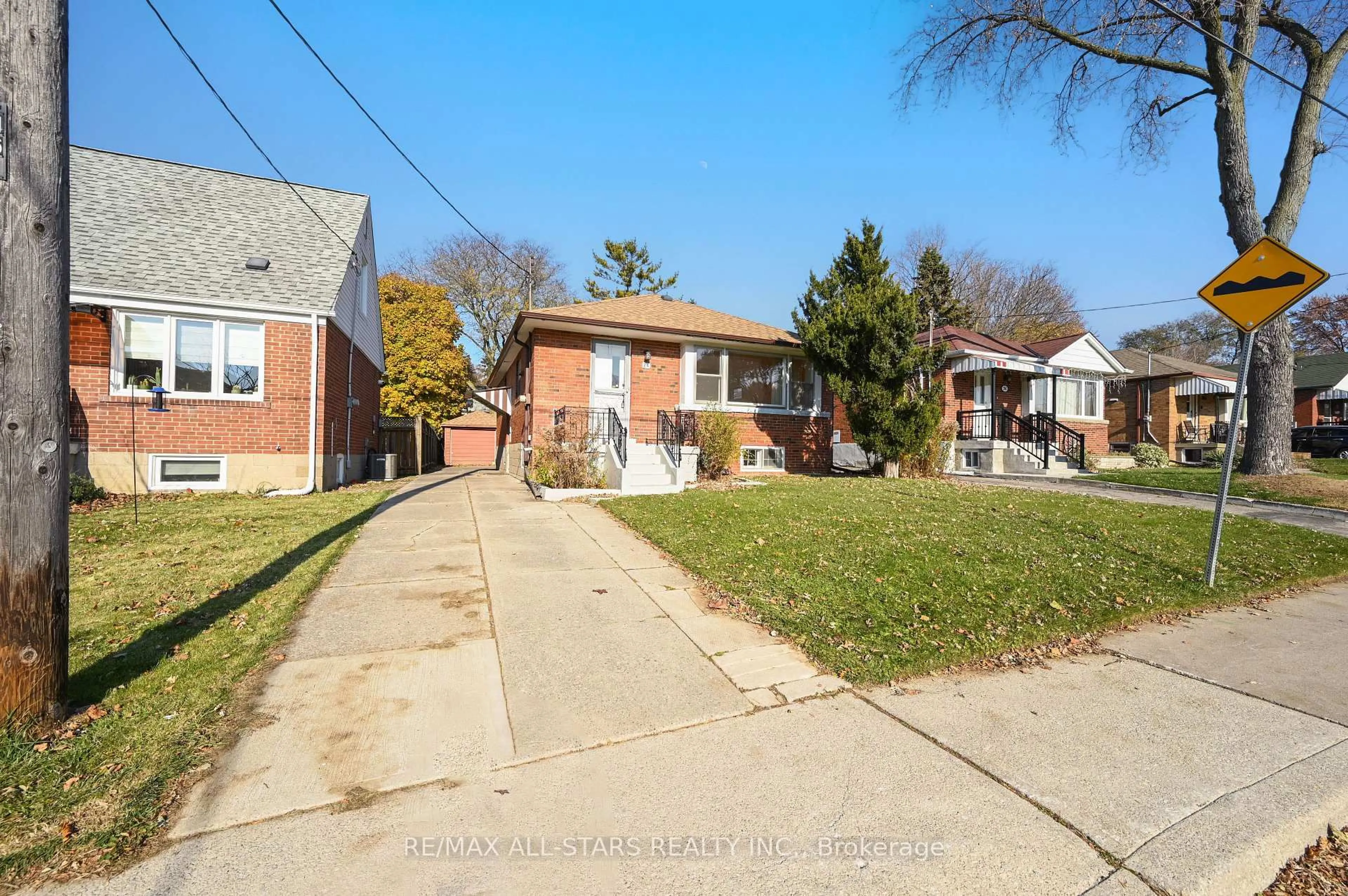Home with brick exterior material, street for 24 Donora Dr, Toronto Ontario M4B 1B5