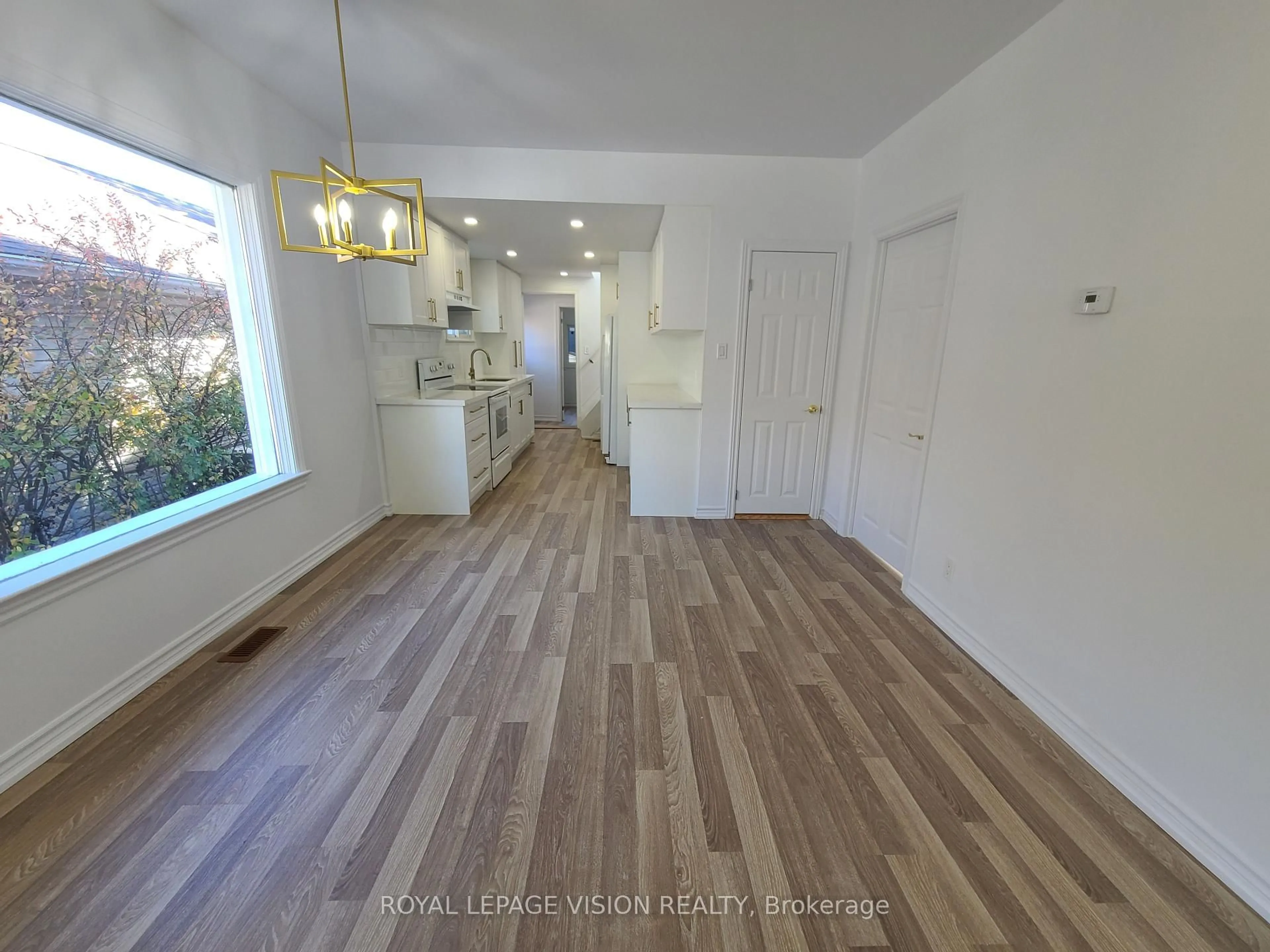 Open concept kitchen, wood/laminate floor for 157 College Ave, Oshawa Ontario L1J 1R3