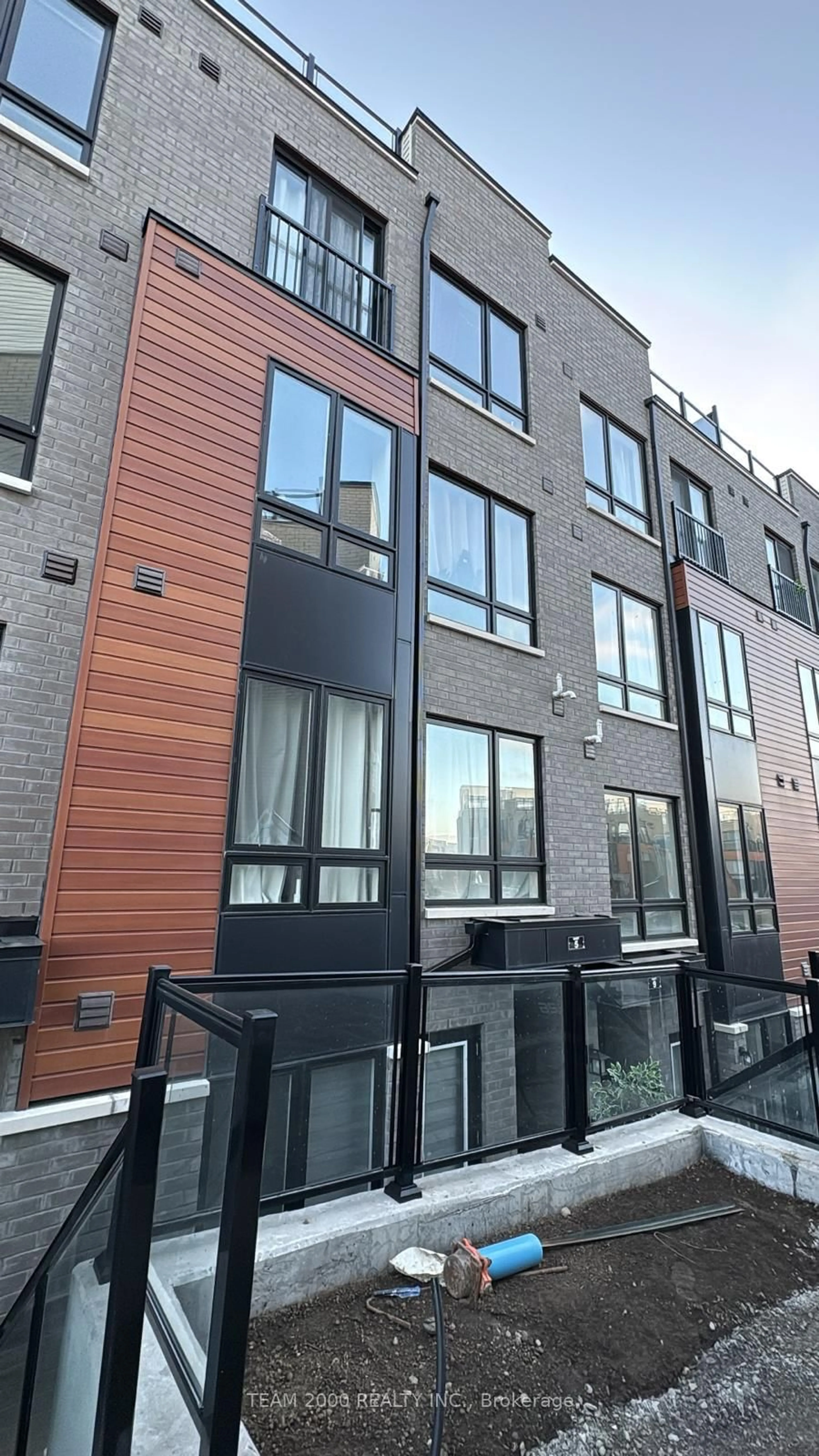 Home with brick exterior material, street for 145 Tapscott Rd #17, Toronto Ontario M1B 0E8