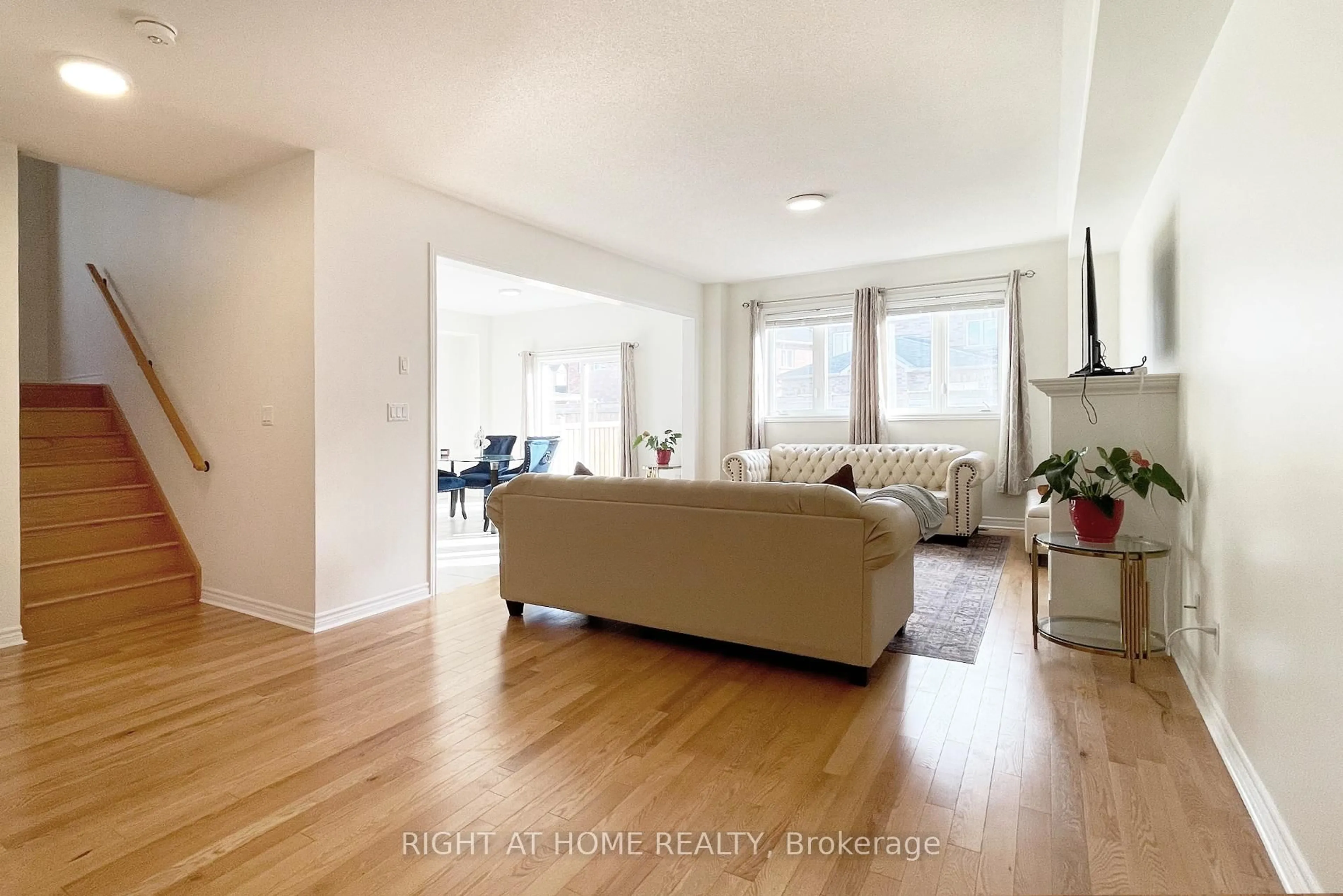 Living room with furniture, wood/laminate floor for 973 Black Cherry Dr, Oshawa Ontario L1K 0P2