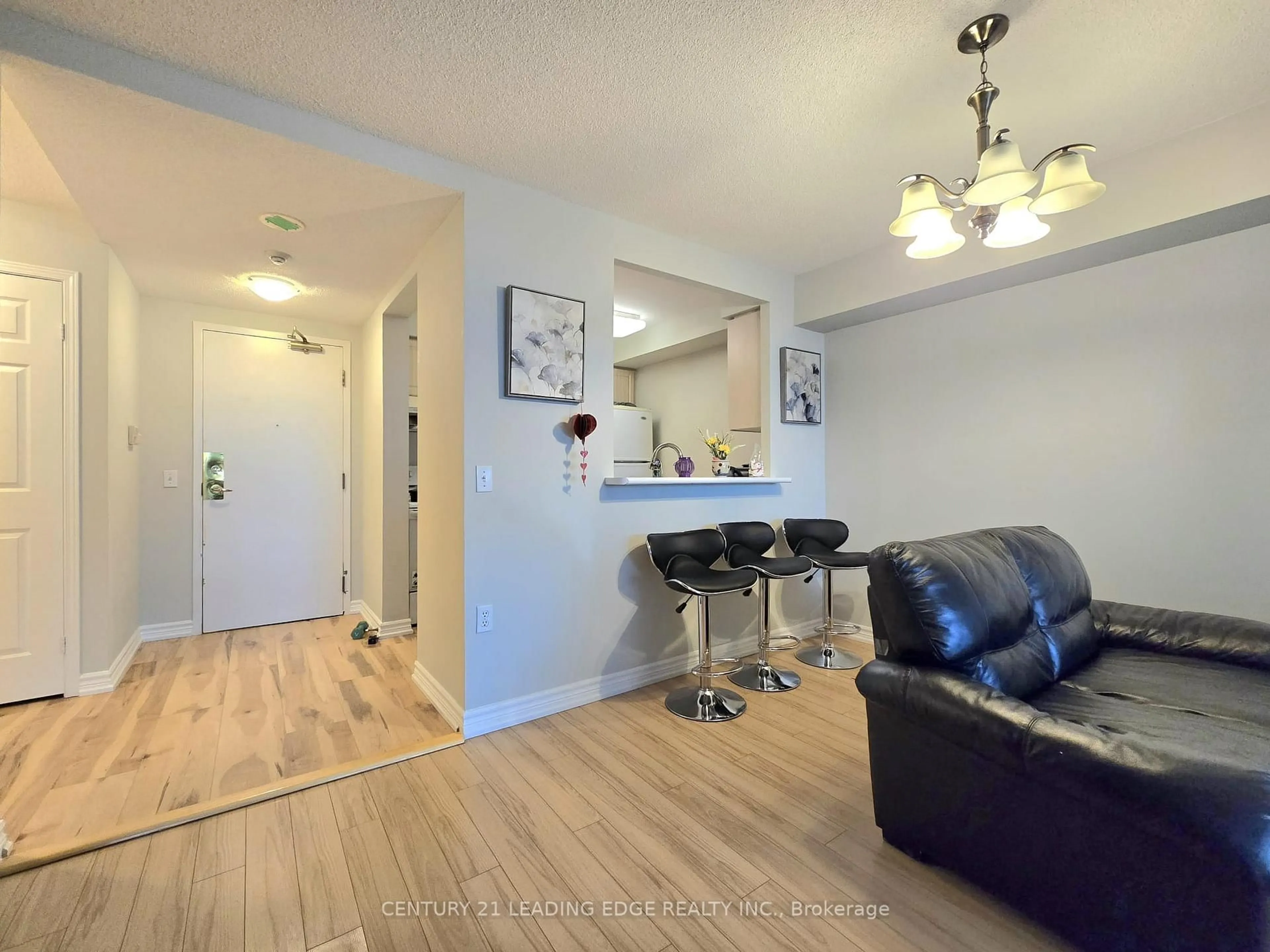 Living room with furniture, wood/laminate floor for 5001 Finch Ave #610, Toronto Ontario M1S 5J9
