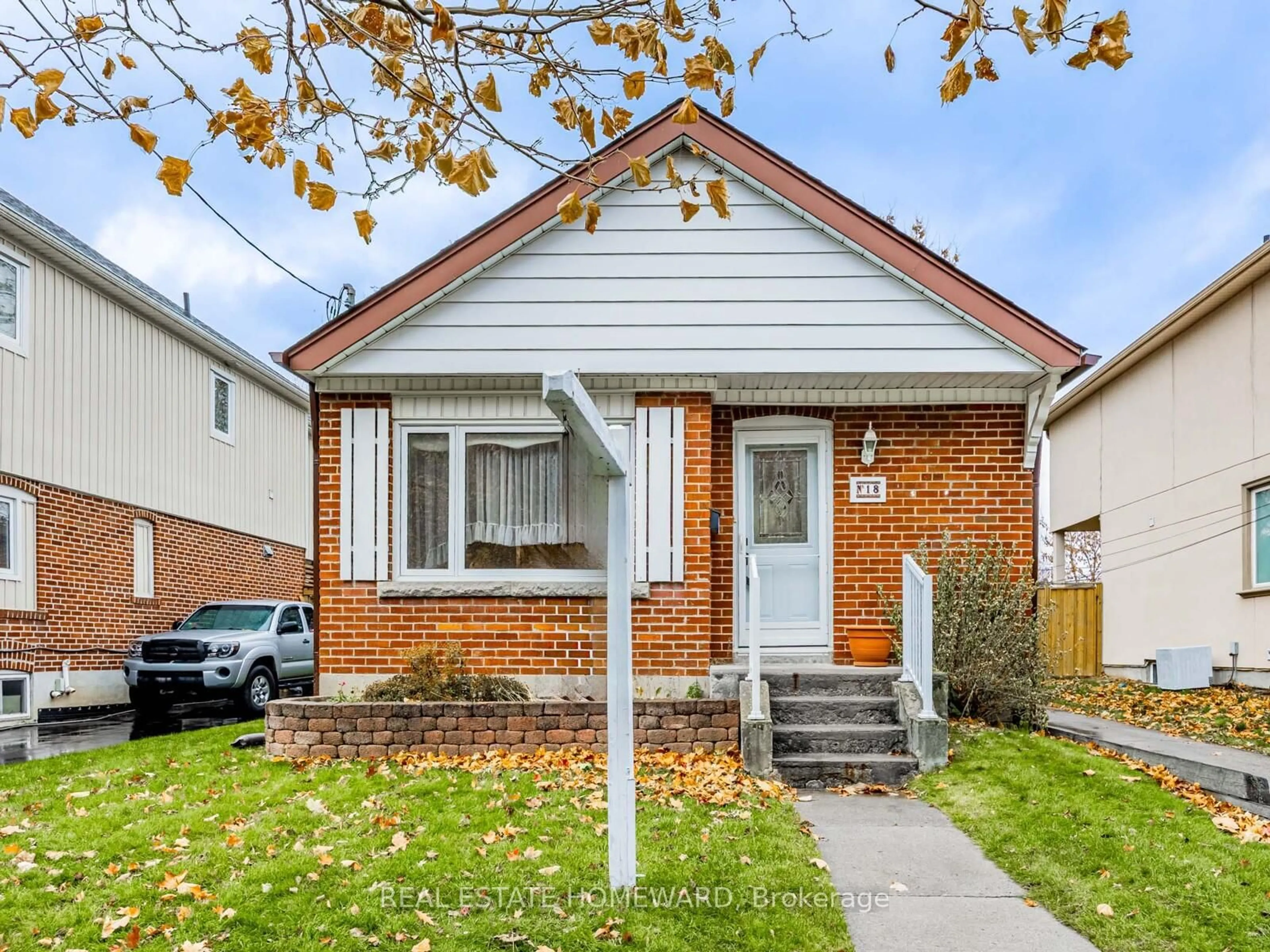 Home with brick exterior material, street for 18 Herron Ave, Toronto Ontario M1L 3V7