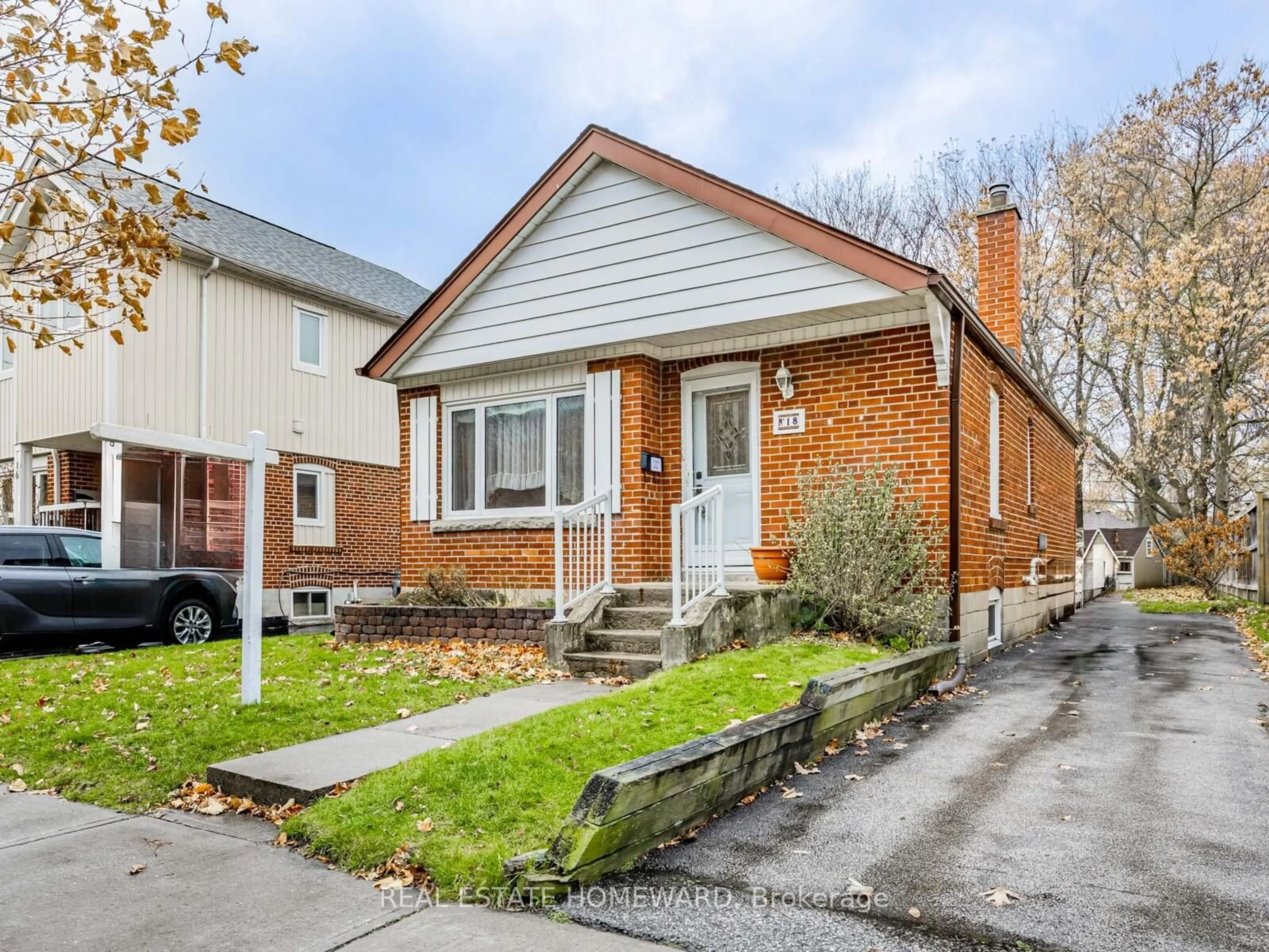 Home with brick exterior material, street for 18 Herron Ave, Toronto Ontario M1L 3V7