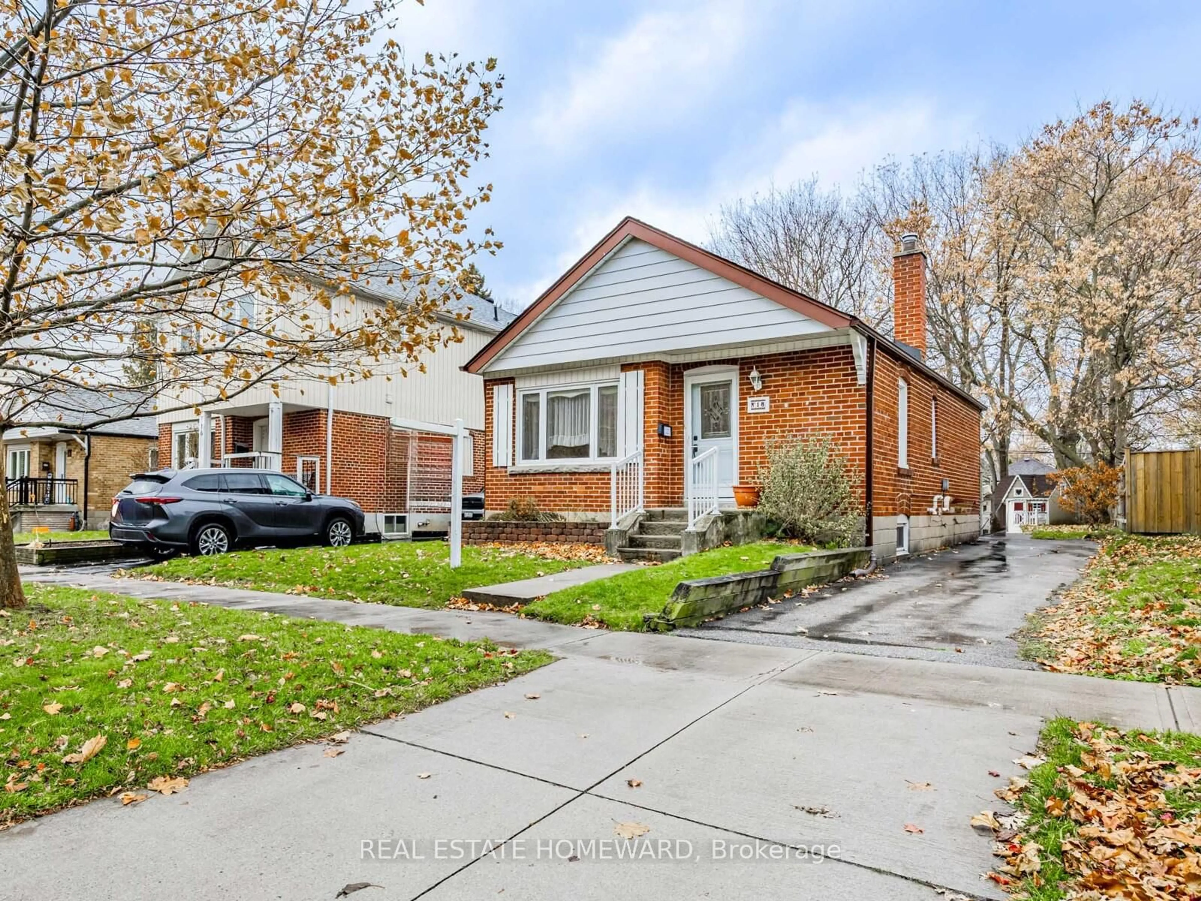 Home with brick exterior material, street for 18 Herron Ave, Toronto Ontario M1L 3V7
