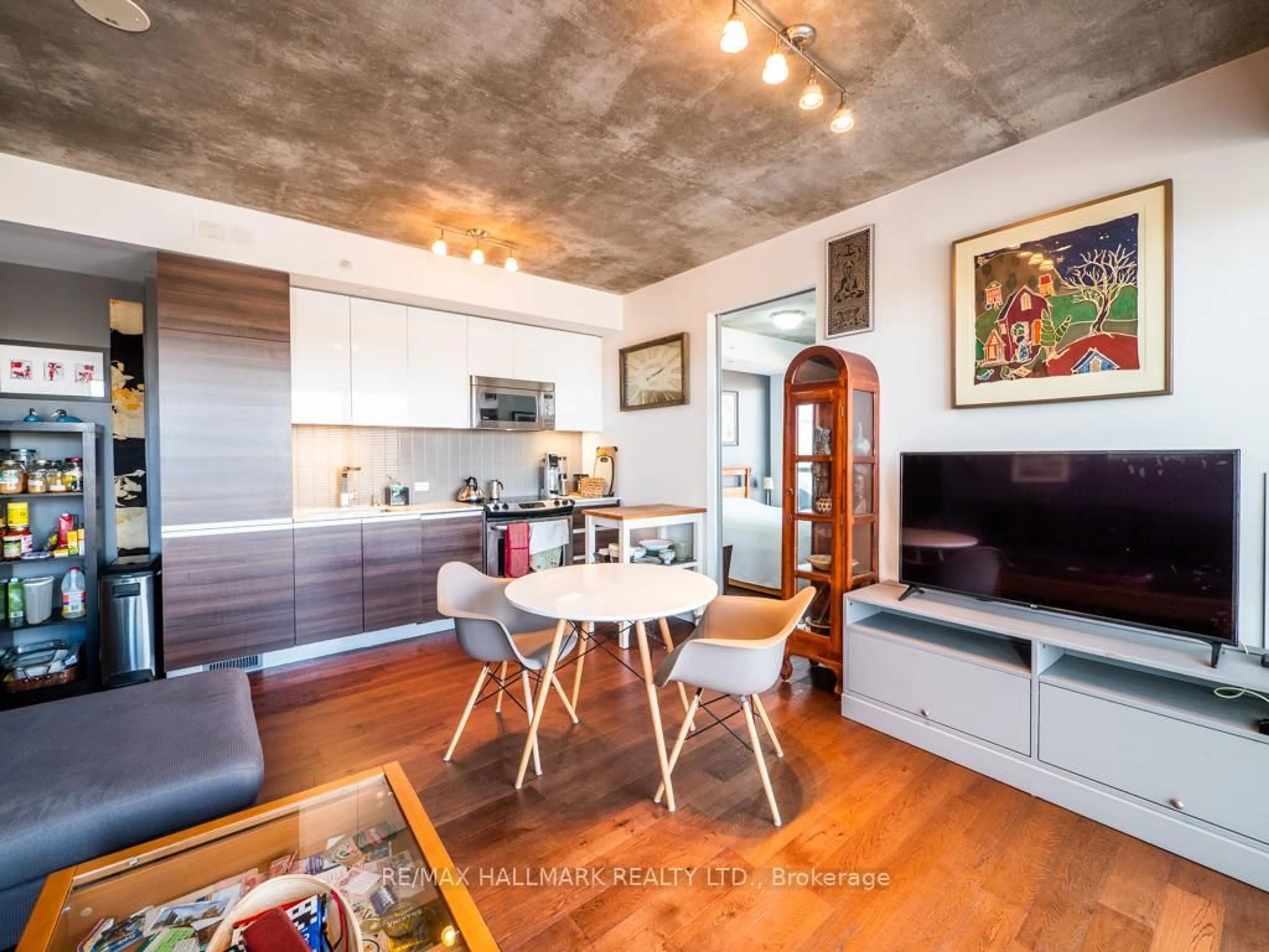 Open concept kitchen, cement floor for 1238 Dundas St #602, Toronto Ontario M4M 0C6