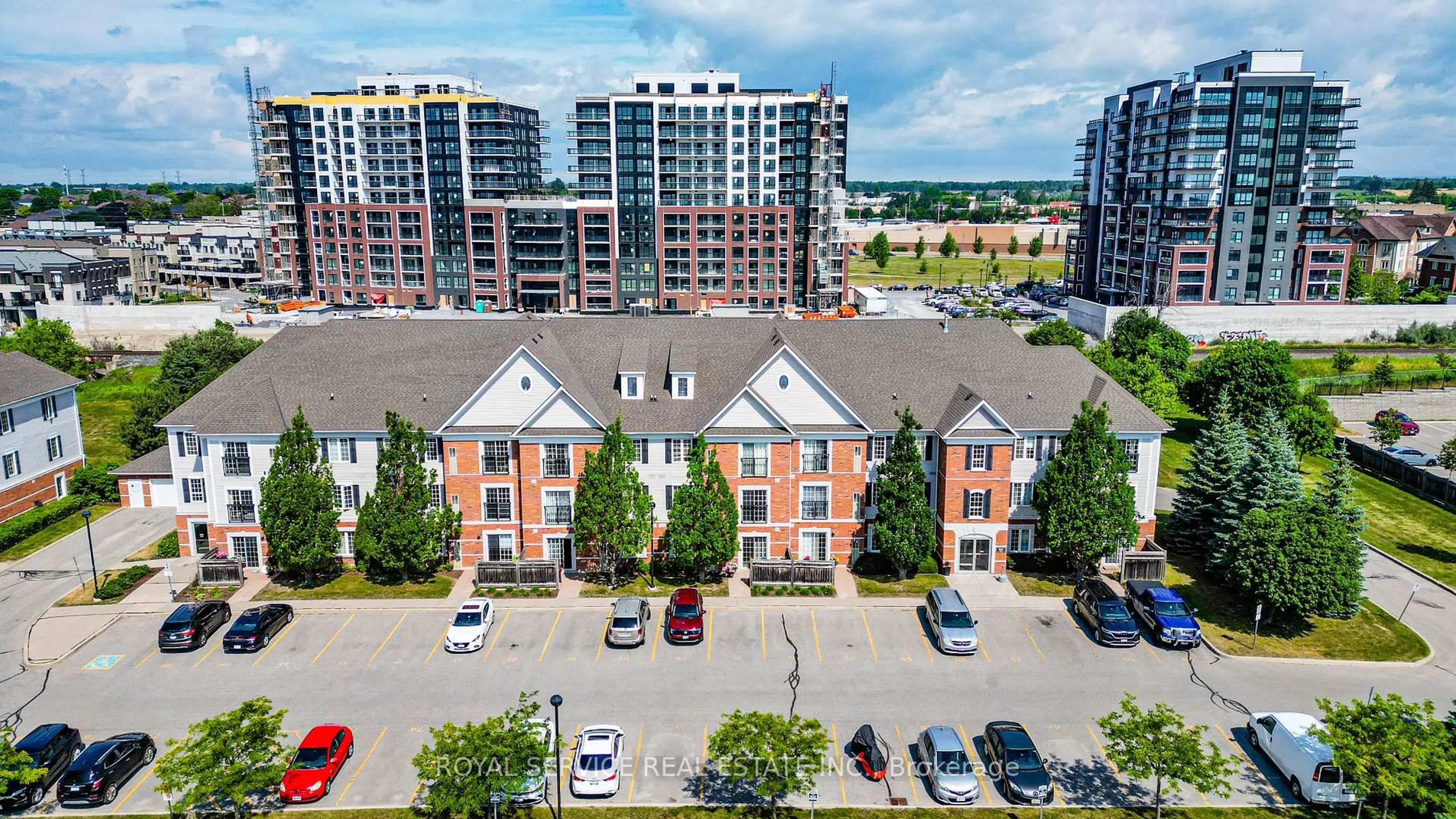A pic from outside/outdoor area/front of a property/back of a property/a pic from drone, city buildings view from balcony for 90 Aspen Springs Dr #207, Clarington Ontario L1C 5N3